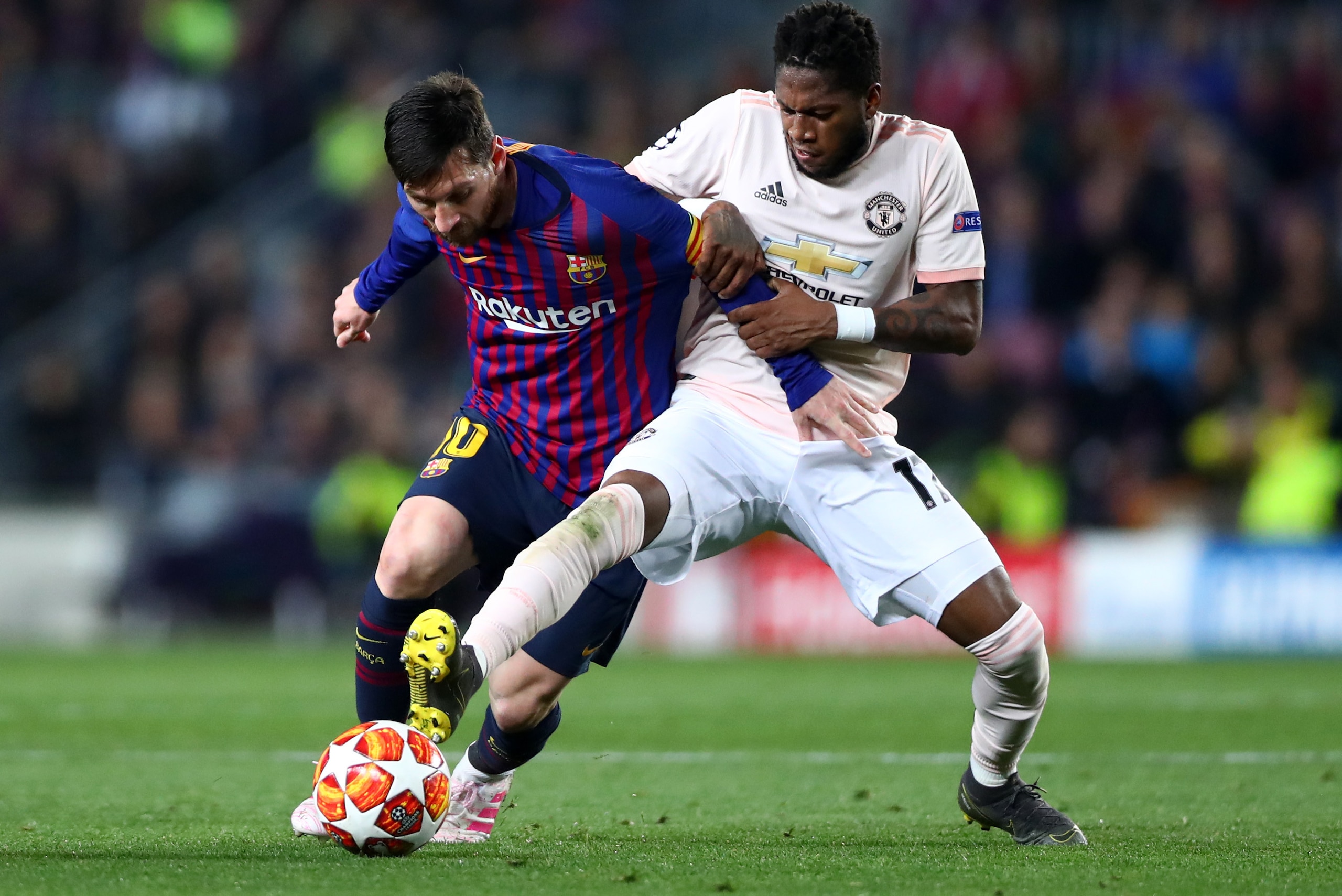 BARCELONA, SPAIN - APRIL 16: Lionel Messi of FC Barcelona and Fred of Manchester United in action during the UEFA Champions League Quarter Final second leg match between FC Barcelona and Manchester United at Camp Nou on April 16, 2019 in Barcelona, Spain.