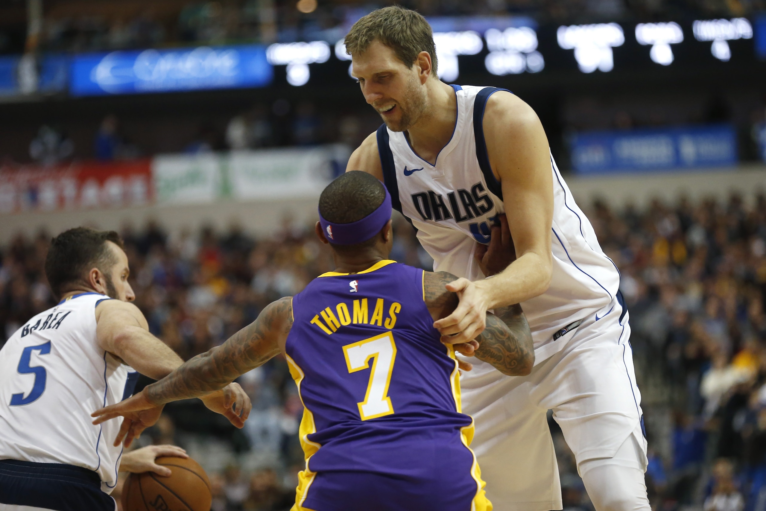 DALLAS, TX - FEBRUARY 10: Dirk Nowitzki #41 of the Dallas Mavericks sets a screen on Isaiah Thomas #7 of the Los Angeles Lakers in the second half at American Airlines Center on February 10, 2018 in Dallas, Texas. The Mavericks won 130-123. (Photo by Ron 