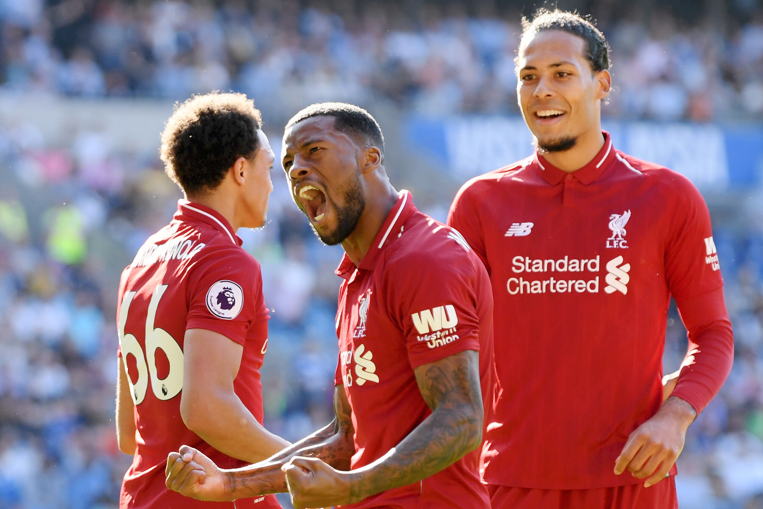 CARDIFF, WALES - APRIL 21:  Georginio Wijnaldum of Liverpool (front) celebrates as he scores his team's first goal during the Premier League match between Cardiff City and Liverpool FC at Cardiff City Stadium on April 21, 2019 in Cardiff, United Kingdom. 