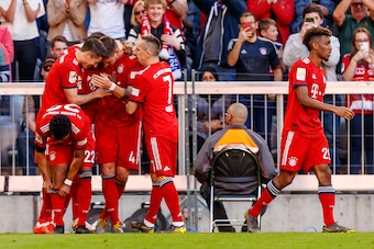 MUNICH, GERMANY - APRIL 20: Niklas Suele of FC Bayern Muenchen celebrates after scoring his team's first goal with team mates during the Bundesliga match between FC Bayern Muenchen and SV Werder Bremen at Allianz Arena on April 20, 2019 in Munich, Germany