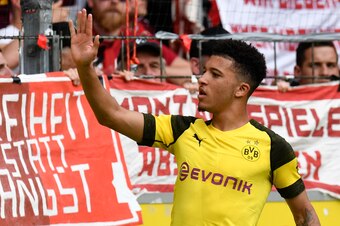 Dortmund's English midfielder Jadon Sancho celebrates after he scored the first goal during the German first division Bundesliga football match SC Freiburg v Borussia Dortmund in Freiburg, southern Germany, on April 21, 2019. (Photo by THOMAS KIENZLE / AF