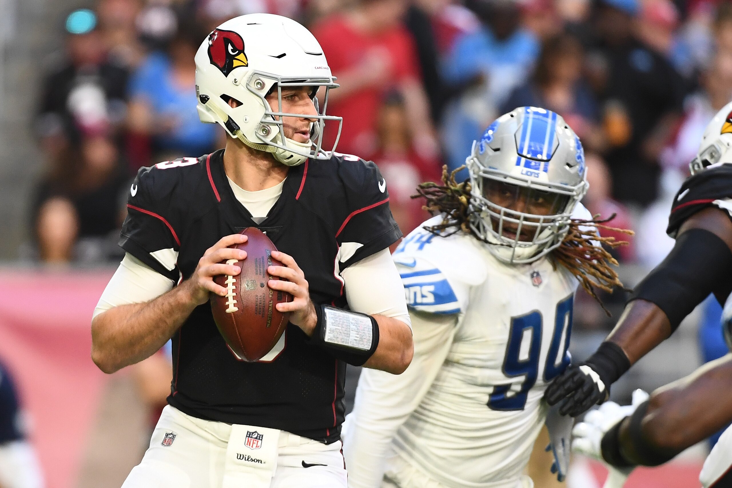 GLENDALE, ARIZONA - DECEMBER 09: Josh Rosen #3 of the Arizona Cardinals looks to make a pass in front of Ezekiel Ansah #94 of the Detroit Lions in the first half at State Farm Stadium on December 09, 2018 in Glendale, Arizona. (Photo by Jennifer Stewart/G