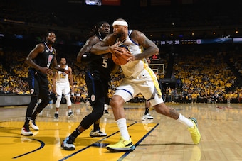OAKLAND, CA - APRIL 13: DeMarcus Cousins #0 of the Golden State Warriors drives past Montrezl Harrell #5 of the LA Clippers during Game One of Round One of the 2019 NBA Playoffs on April 13, 2019 at ORACLE Arena in Oakland, California. NOTE TO USER: User 