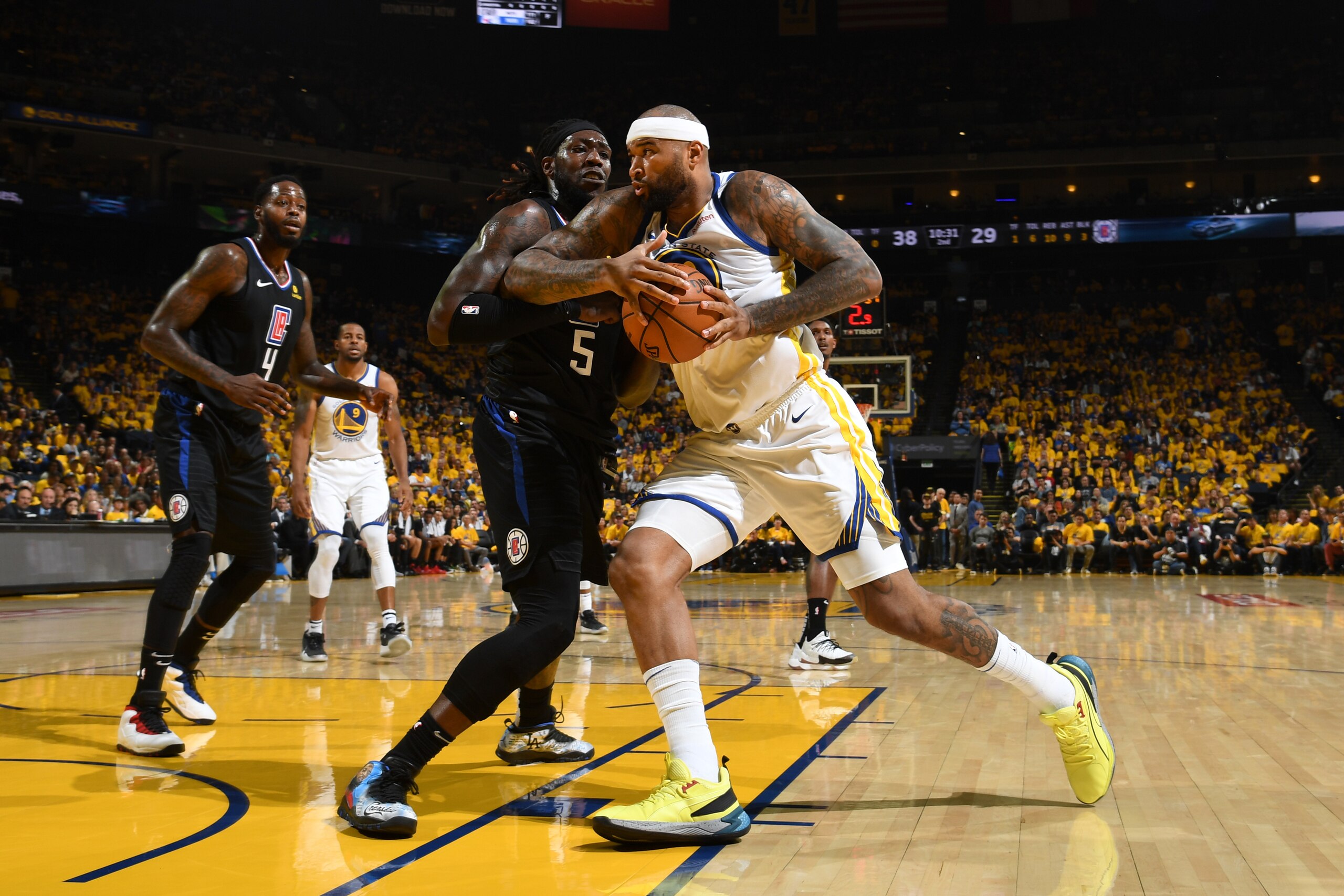 OAKLAND, CA - APRIL 13: DeMarcus Cousins #0 of the Golden State Warriors drives past Montrezl Harrell #5 of the LA Clippers during Game One of Round One of the 2019 NBA Playoffs on April 13, 2019 at ORACLE Arena in Oakland, California. NOTE TO USER: User 
