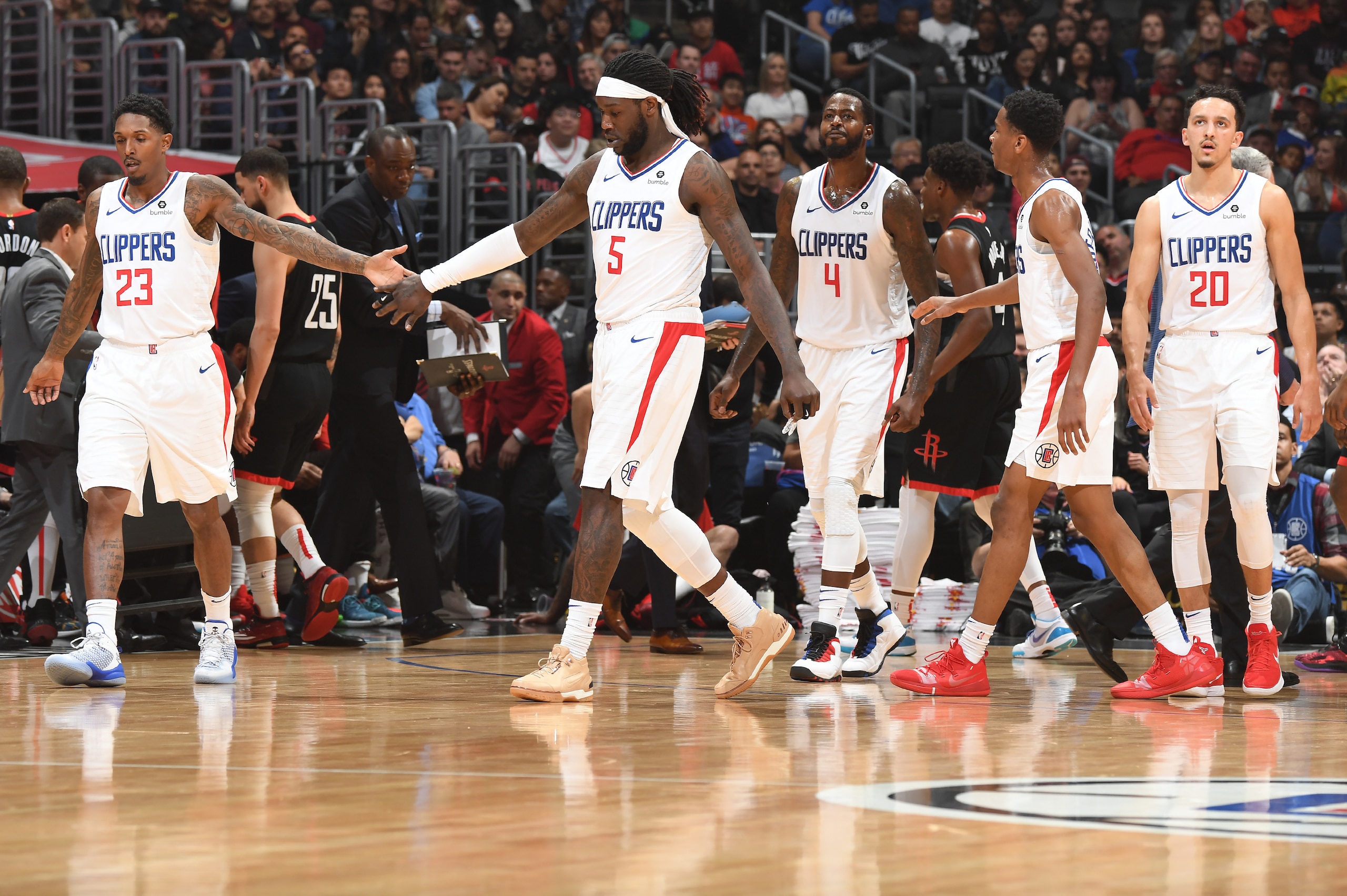 LOS ANGELES, CA - APRIL 3: Lou Williams #23, Montrezl Harrell #5 of the LA Clippers hi-five each other against the Houston Rockets on April 3, 2019 at STAPLES Center in Los Angeles, California. NOTE TO USER: User expressly acknowledges and agrees that, by