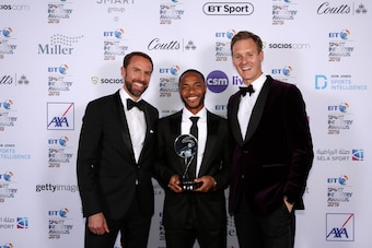LONDON, ENGLAND - APRIL 25: Gareth Southgate, Manager of England (L) and Dan Walker (R) pose for a photo with The Integrity and Impact Award founded by Dow Jones Intelligence winner, Raheem Sterling (C) at the BT Sport Industry Awards 2019 at Battersea Ev