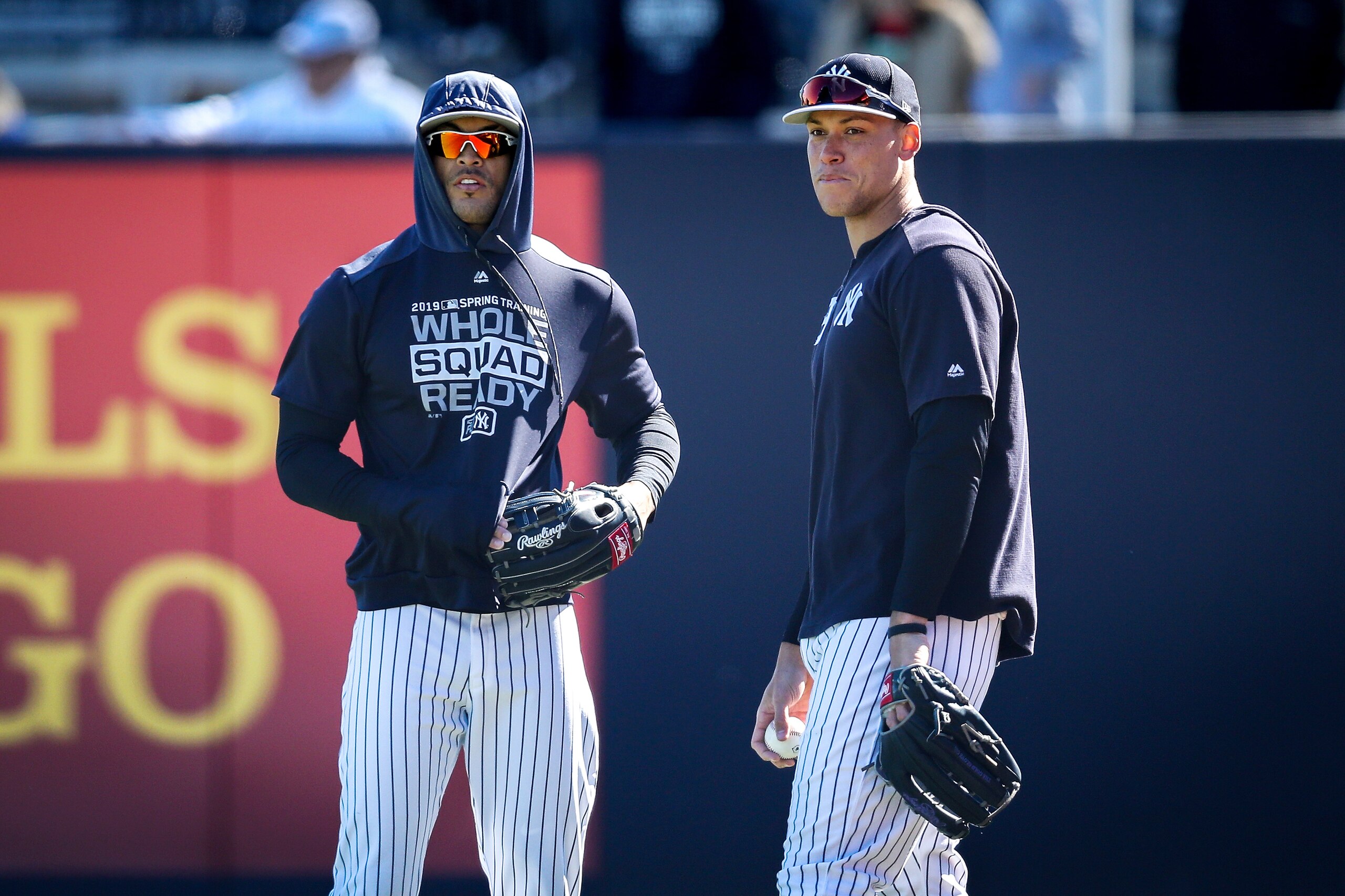 TAMPA, FLORIDA - MARCH 06:  Giancarlo Stanton #27 and Aaron Judge #99 of the New York Yankees look on before the Grapefruit League spring training game against the St. Louis Cardinals at Steinbrenner Field on March 06, 2019 in Tampa, Florida. (Photo by Dy
