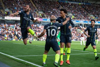 BURNLEY, ENGLAND - APRIL 28: Sergio Aguero of Manchester City celebrates his goal with team mates Bernardo Silva, Leroy Sane and David Silva during the Premier League match between Burnley FC and Manchester City at Turf Moor on April 28, 2019 in Burnley, 