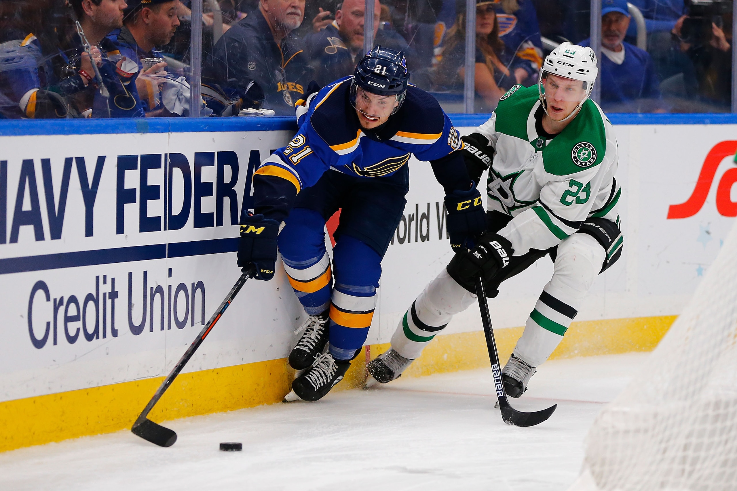 ST. LOUIS, MO - APRIL 27: Tyler Bozak #21 of the St. Louis Blues and Esa Lindell #23 of the Dallas Stars fight for control of the puck in Game Two of the Western Conference Second Round during the 2019 NHL Stanley Cup Playoffs at the Enterprise Center on 