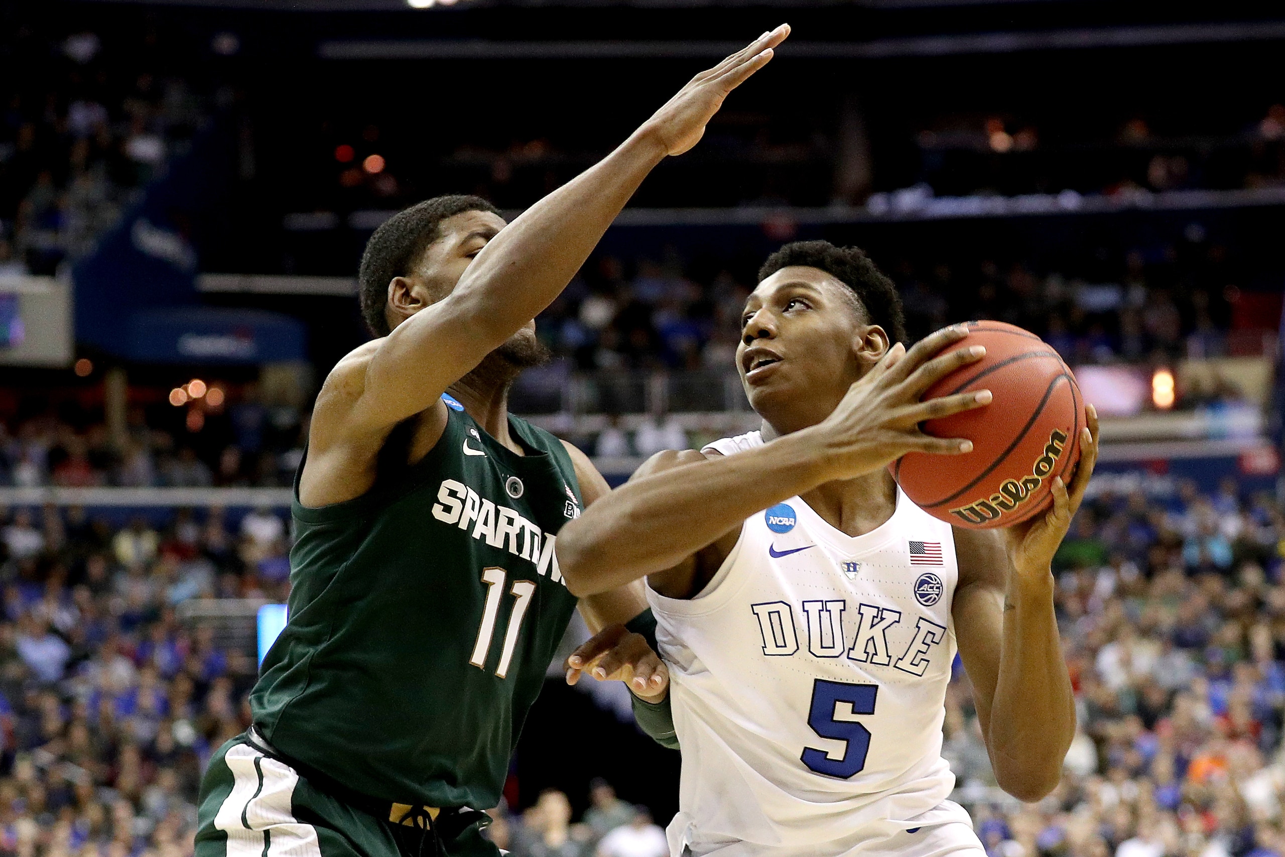 WASHINGTON, DC - MARCH 31:  RJ Barrett #5 of the Duke Blue Devils is defended by Aaron Henry #11 of the Michigan State Spartans during the second half in the East Regional game of the 2019 NCAA Men's Basketball Tournament at Capital One Arena on March 31,