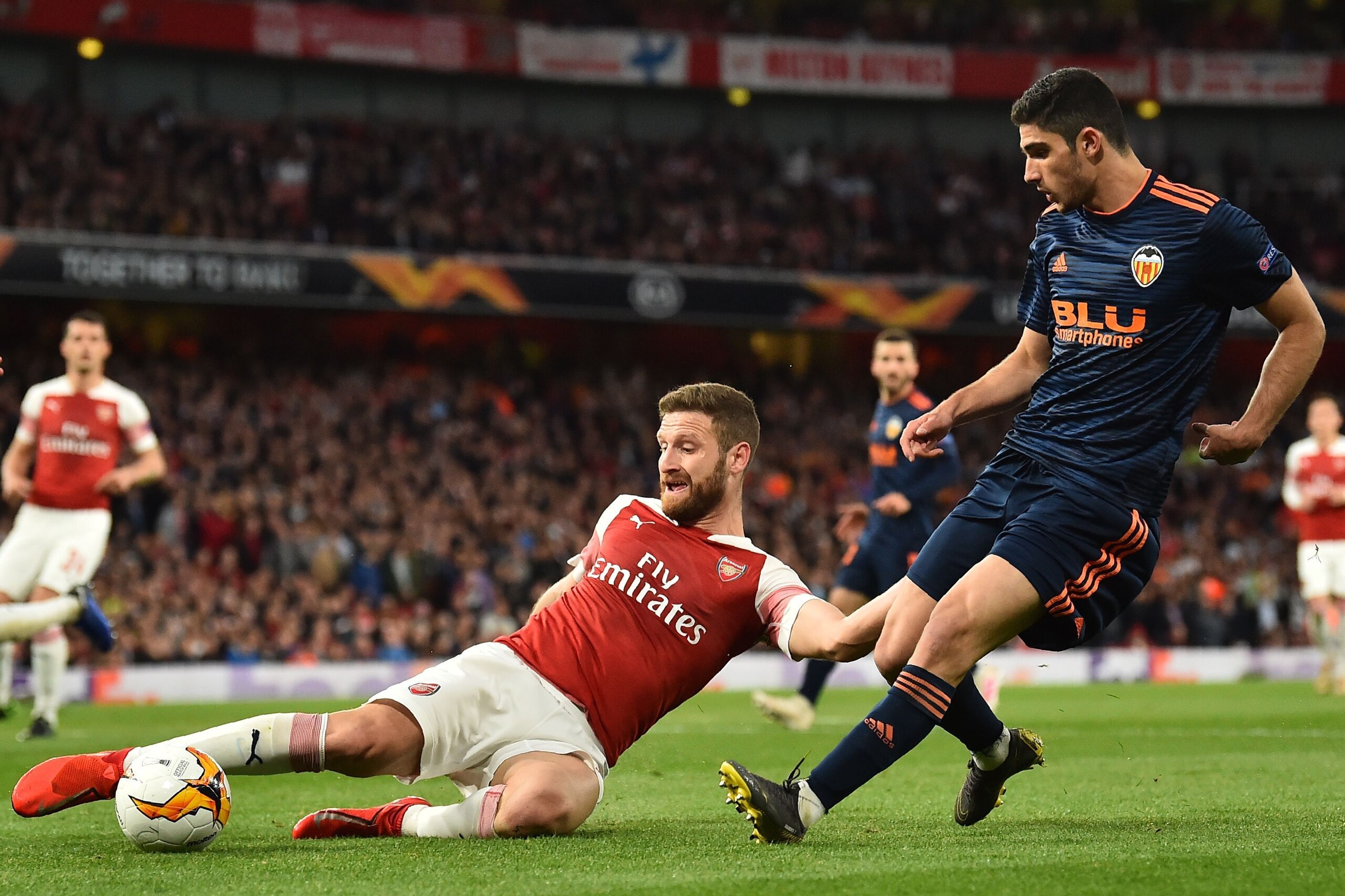 Arsenal's German defender Shkodran Mustafi (L) vies with Valencia's Portuguese midfielder Goncalo Guedes (R) during the UEFA Europa League semi final, first leg, football match between Arsenal and Valencia at the Emirates Stadium in London on May 2, 2019.