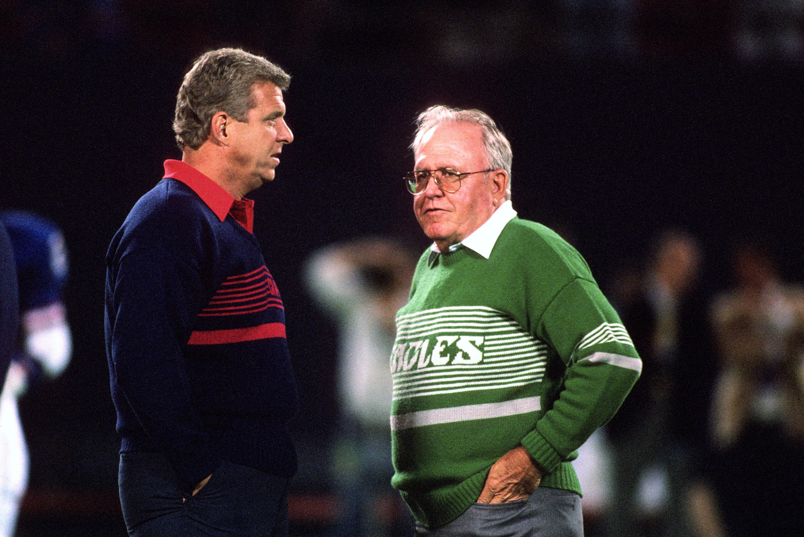 EAST RUTHERFORD, NJ - SEPTEMBER 9: Head Coach Buddy Ryan of the Philadelphia Eagles talks with head coach Bill Parcells of the New York Giants prior to the start of an NFL football game September 9, 1990 at Giant Stadium in East Rutherford, New Jersey. Ry