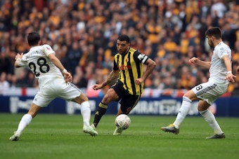 LONDON, ENGLAND - APRIL 07: Troy Deeney of Watford in action with Joao Moutinho and Ruben Neves of Wolverhampton Wanderers during the FA Cup Semi Final match between Watford and Wolverhampton Wanderers at Wembley Stadium on April 07, 2019 in London, Eng LONDON, ENGLAND - APRIL 07: Troy Deeney of Watford in action with Joao Moutinho and Ruben Neves of Wolverhampton Wanderers during the FA Cup Semi Final match between Watford and Wolverhampton Wanderers at Wembley Stadium on April 07, 2019 in London, Eng