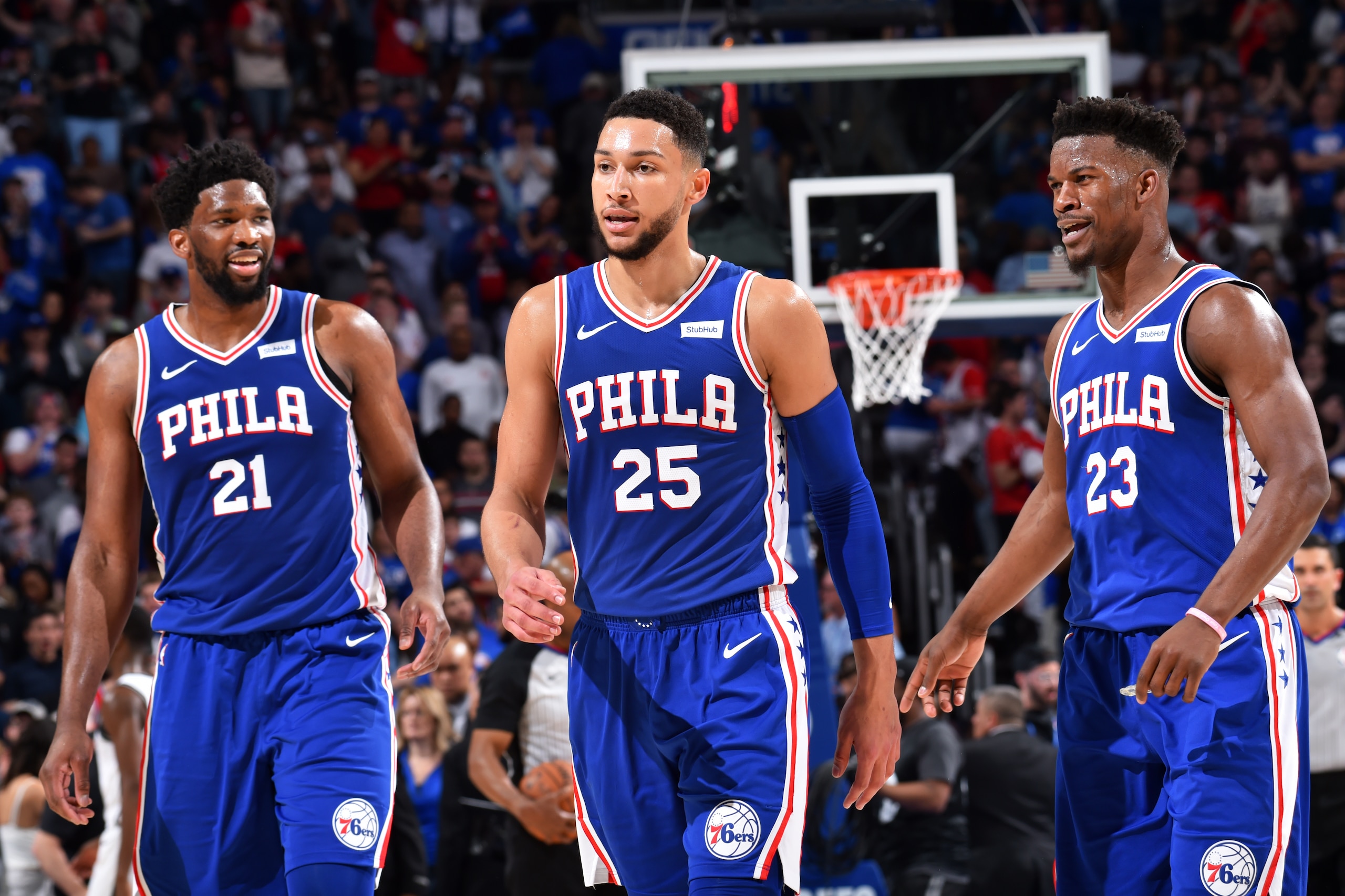PHILADELPHIA, PA - April 23: Joel Embiid #21, Ben Simmons #25, and Jimmy Butler #23 of the Philadelphia 76ers look on during a game against the Brooklyn Nets during Round One Game Five of the 2019 NBA Playoffs on April 23, 2019 at the Wells Fargo Center i