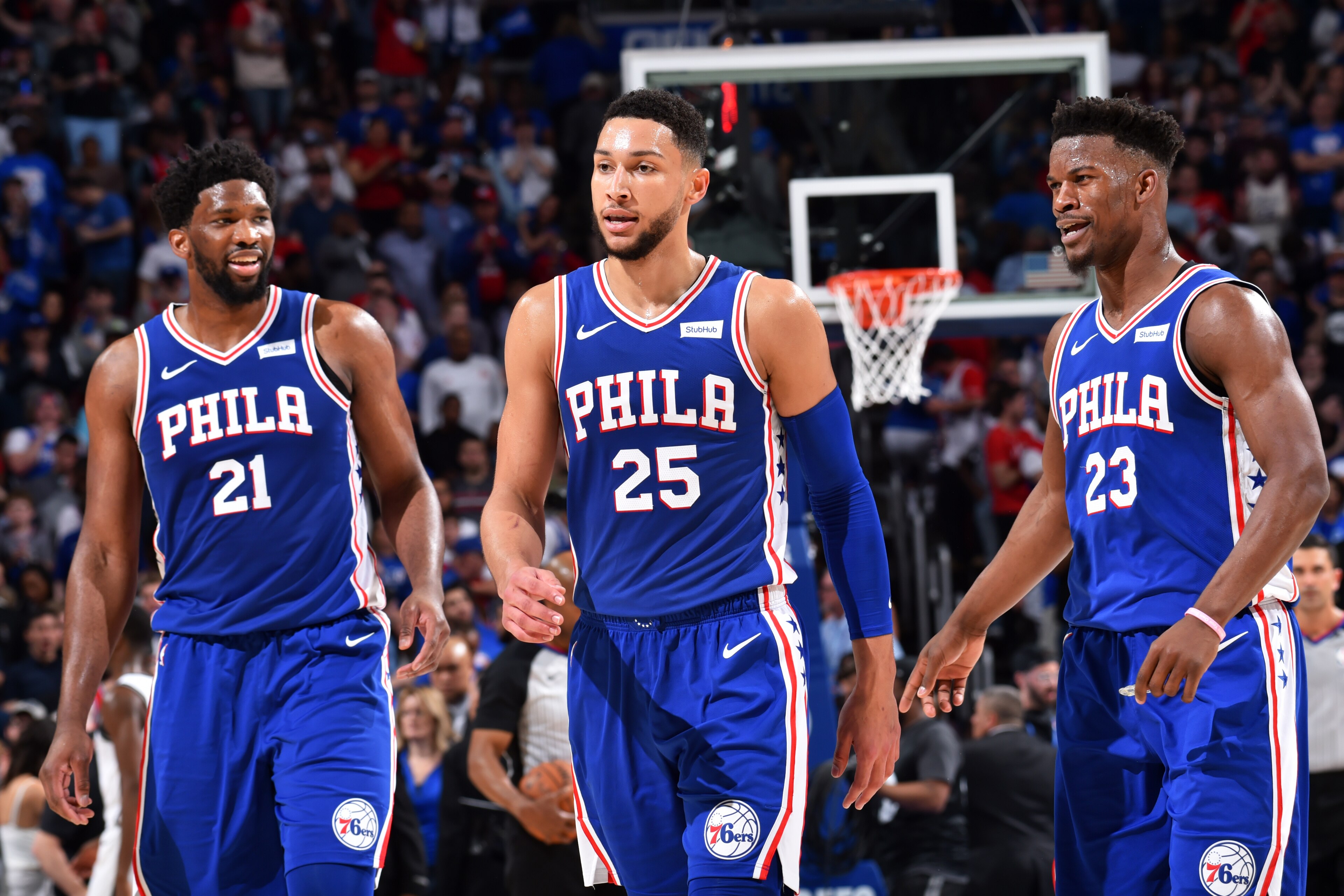 PHILADELPHIA, PA - April 23: Joel Embiid #21, Ben Simmons #25, and Jimmy Butler #23 of the Philadelphia 76ers look on during a game against the Brooklyn Nets during Round One Game Five of the 2019 NBA Playoffs on April 23, 2019 at the Wells Fargo Center i