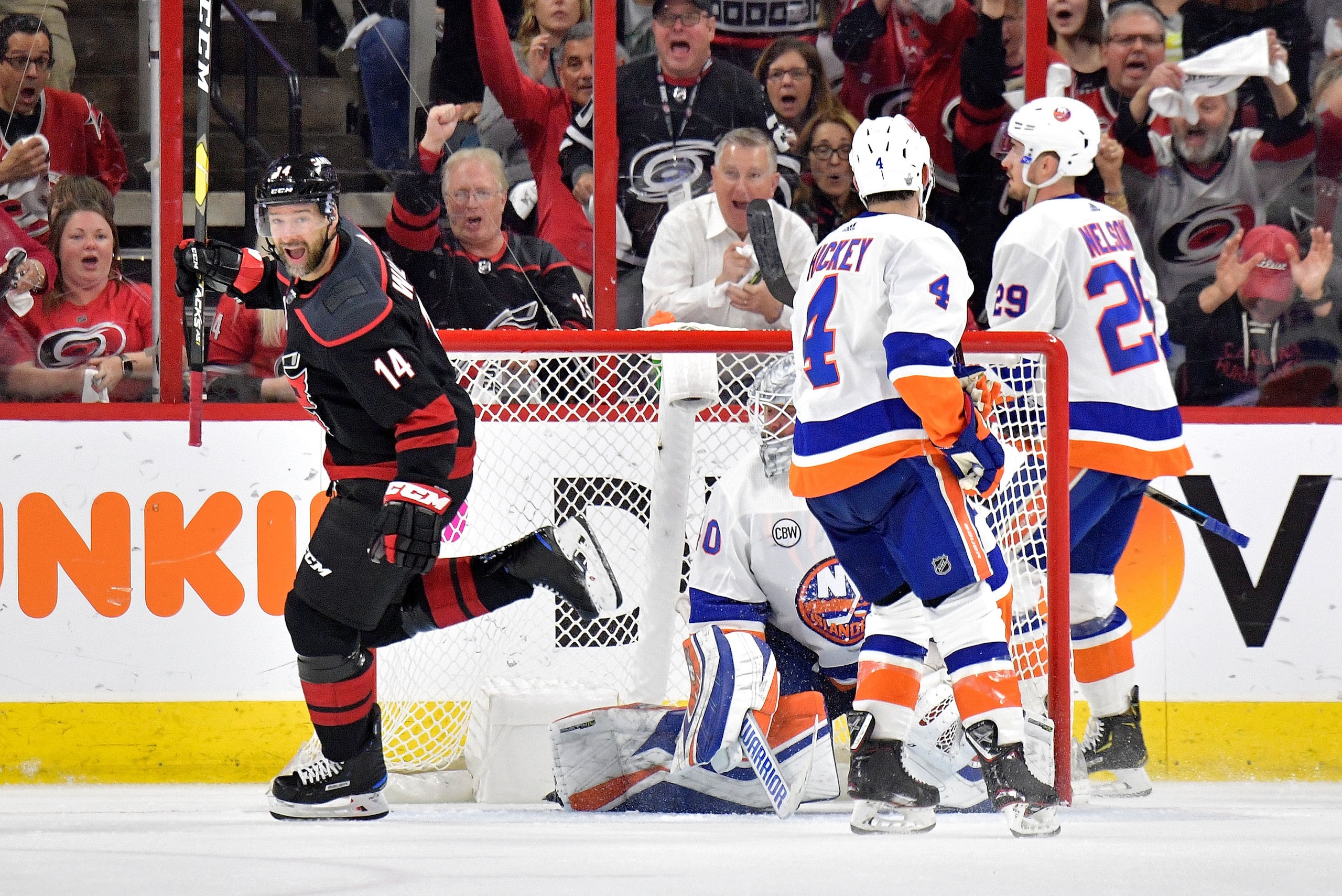 RALEIGH, NORTH CAROLINA - MAY 01: Justin Williams #14 of the Carolina Hurricanes reacts after scoring the go-ahead goal against the New York Islanders during the third period of Game Three of the Eastern Conference Second Round during the 2019 NHL Stanley
