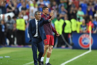 PARIS, FRANCE - JULY 10:  Cristiano Ronaldo and manager Fernando Santos gestures on the touchline during the UEFA EURO 2016 Final match between Portugal and France at Stade de France on July 10, 2016 in Paris, France.  (Photo by Laurence Griffiths/Getty I