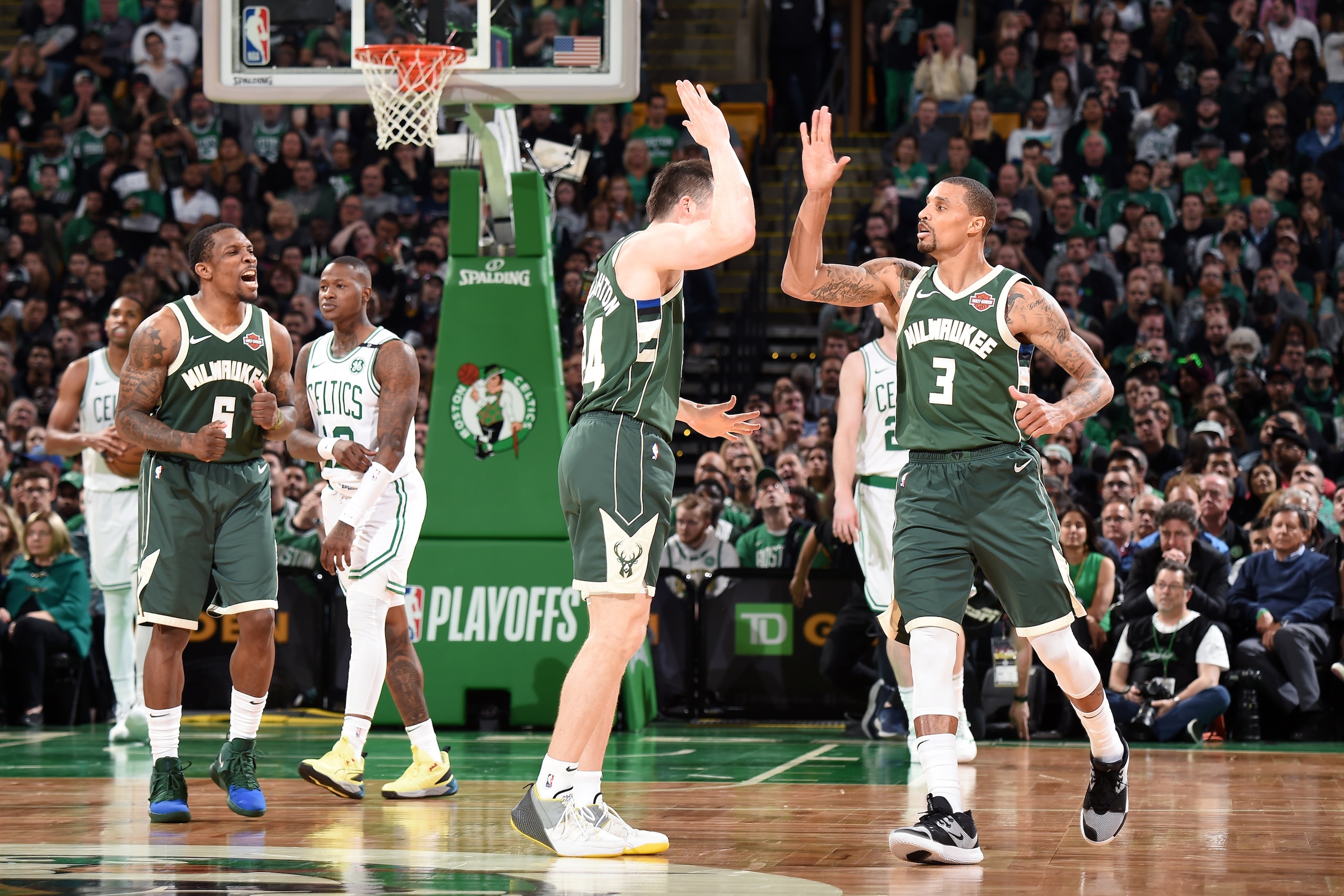 BOSTON, MA - MAY 3: Pat Connaughton #24 and George Hill #3 of the Milwaukee Bucks high five during Game Three of the Eastern Conference Semifinals of the 2019 NBA Playoffs against the Boston Celtics on May 3, 2019 at the TD Garden in Boston, Massachusetts