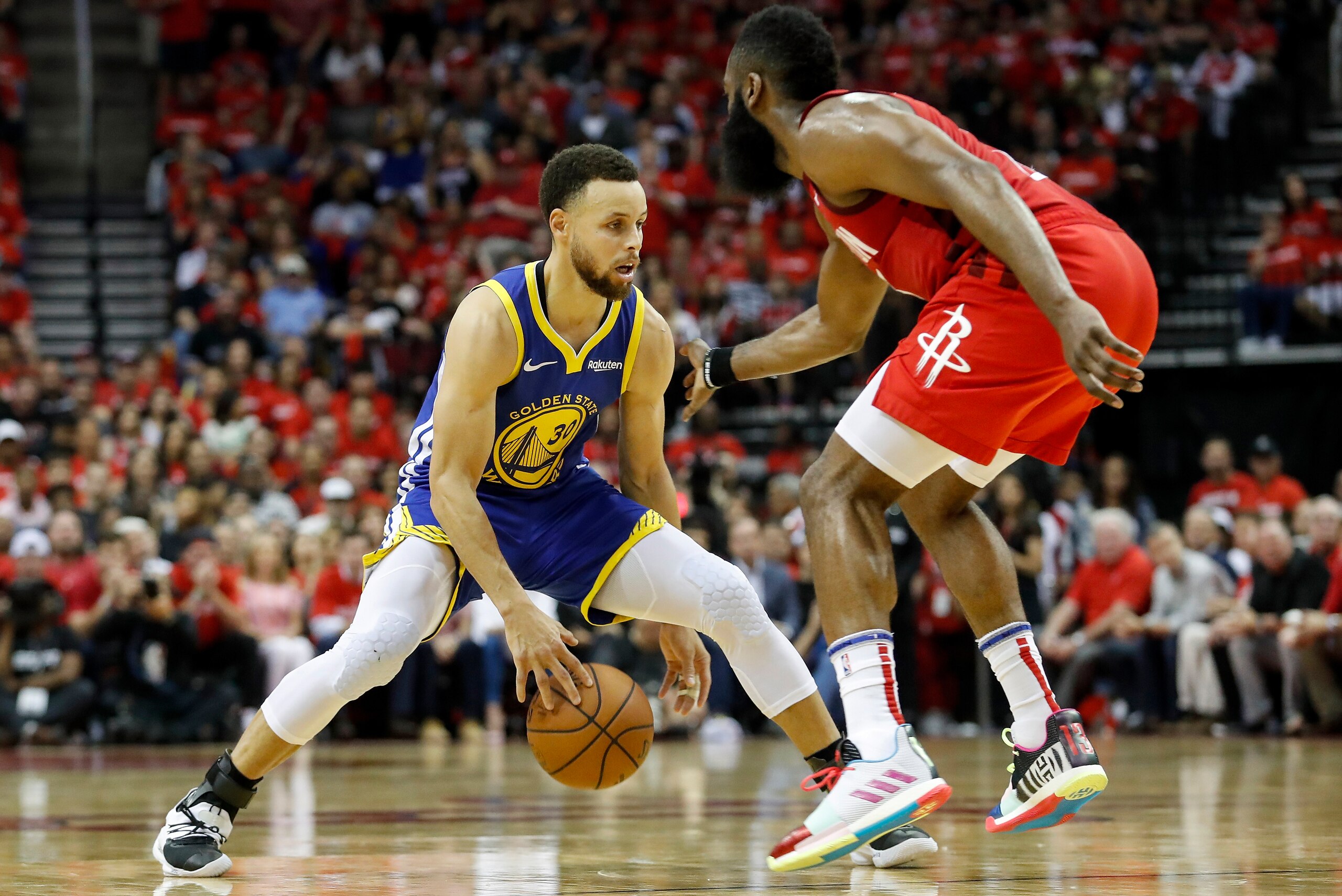 HOUSTON, TX - MAY 04:  Stephen Curry #30 of the Golden State Warriors dribbles the ball defended by James Harden #13 of the Houston Rockets in the fourth quarter during Game Three of the Second Round of the 2019 NBA Western Conference Playoffs at Toyota C