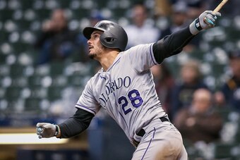 MILWAUKEE, WISCONSIN - MAY 01:  Nolan Arenado #28 of the Colorado Rockies hits a home run in the ninth inning against the Milwaukee Brewers at Miller Park on May 01, 2019 in Milwaukee, Wisconsin. (Photo by Dylan Buell/Getty Images)