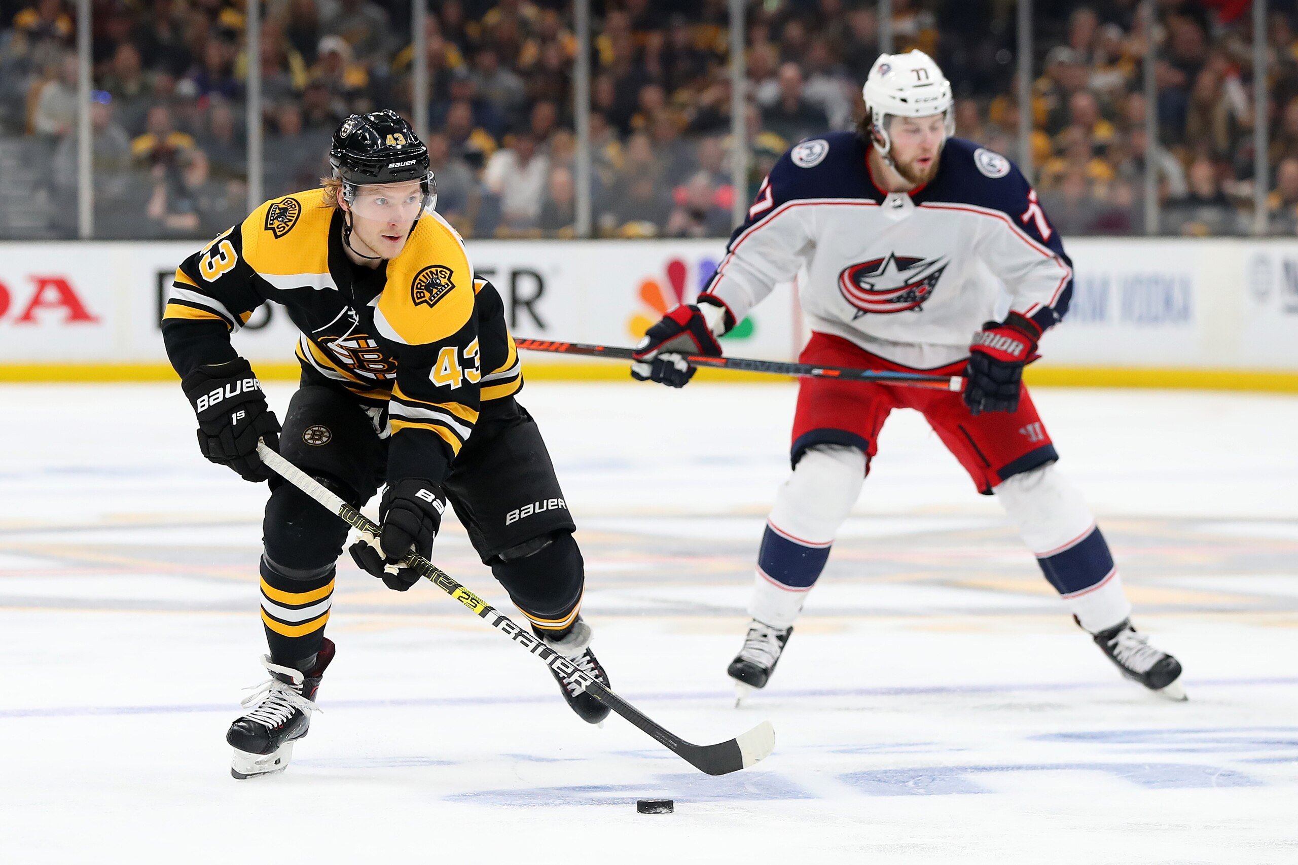 BOSTON, MASSACHUSETTS - MAY 04: Danton Heinen #43 of the Boston Bruins skates against Josh Anderson #77 of the Columbus Blue Jackets during the third period of Game Five of the Eastern Conference Second Round during the 2019 NHL Stanley Cup Playoffs at TD
