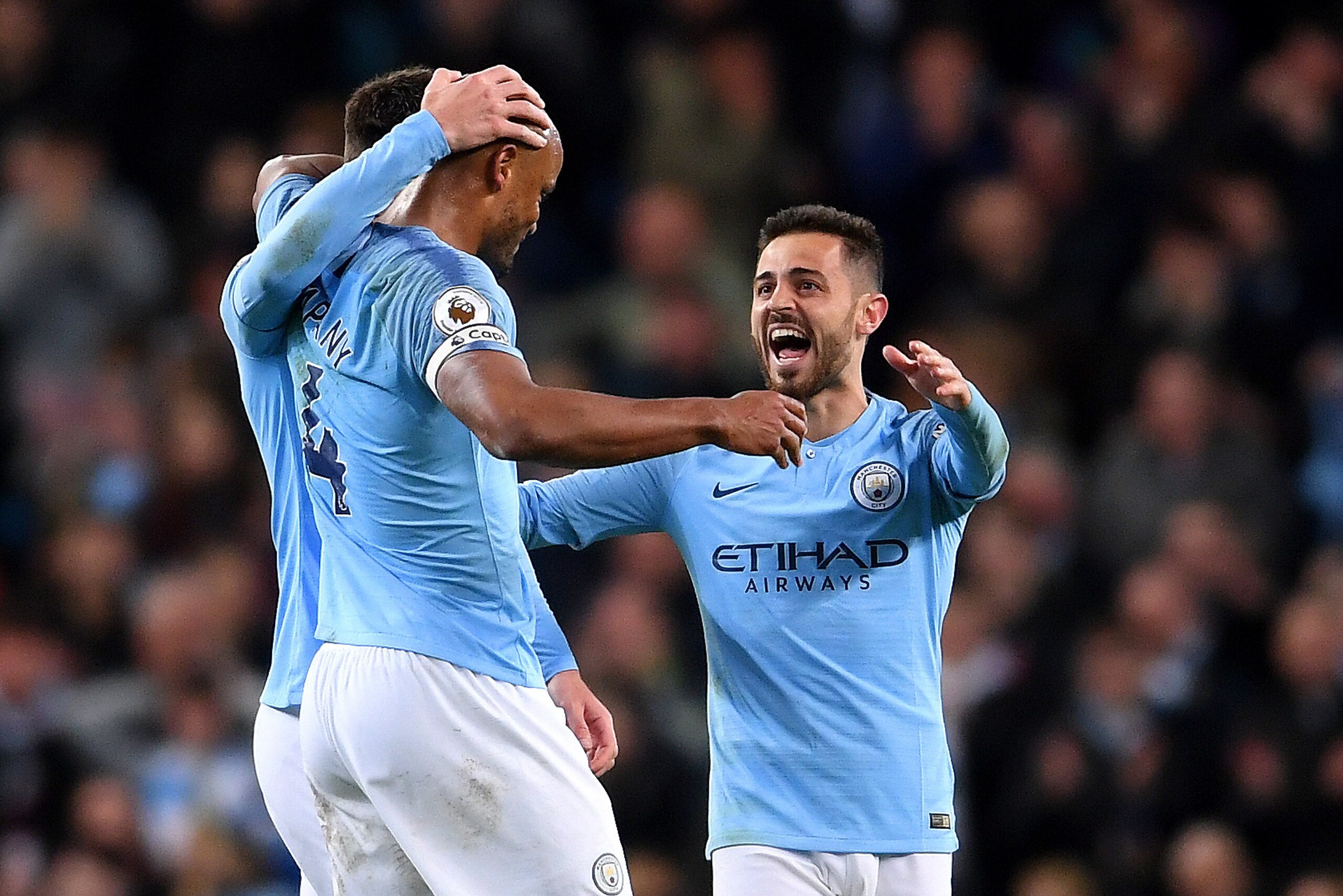 MANCHESTER, ENGLAND - MAY 06: Bernardo Silva of Manchester City celebrates victory with Vincent Kompany of Manchester City during the Premier League match between Manchester City and Leicester City at Etihad Stadium on May 06, 2019 in Manchester, United K MANCHESTER, ENGLAND - MAY 06: Bernardo Silva of Manchester City celebrates victory with Vincent Kompany of Manchester City during the Premier League match between Manchester City and Leicester City at Etihad Stadium on May 06, 2019 in Manchester, United K