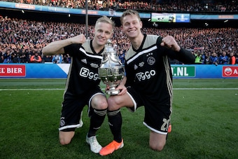 ROTTERDAM, NETHERLANDS - MAY 5: Donny van de Beek of Ajax, Frenkie de Jong of Ajax celebrates the championship with the trophy  during the Dutch KNVB Beker  match between Willem II v Ajax Dutch Toto KNVB Cup Final at the Feyenoord Stadium on May 5, 2019 i
