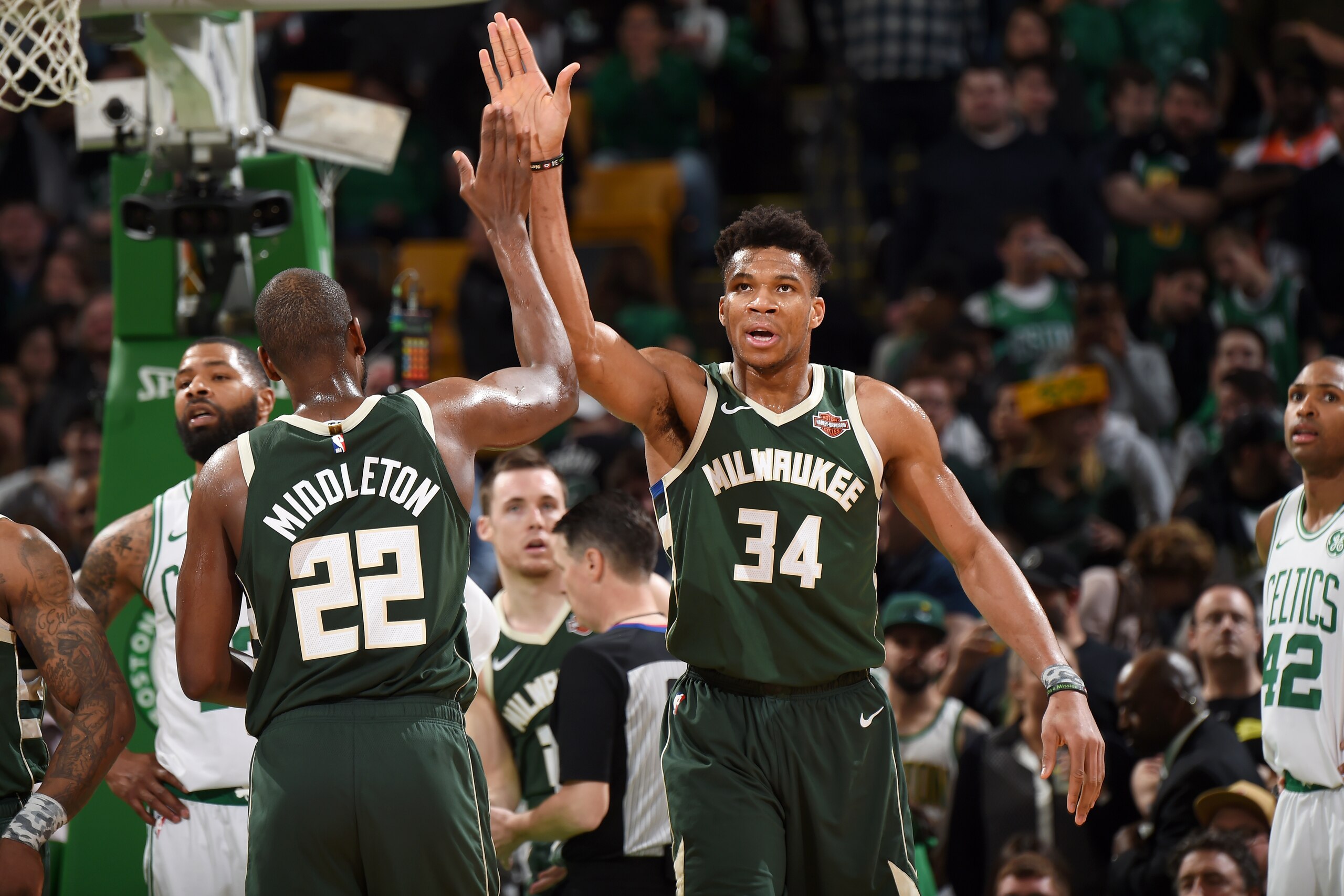 BOSTON, MA - MAY 6: Giannis Antetokounmpo #34 hi-fives Khris Middleton #22 of the Milwaukee Bucks during Game Four of the Eastern Conference Semifinals of the 2019 NBA Playoffs on May 6, 2019 at the TD Garden in Boston, Massachusetts. NOTE TO USER: User e
