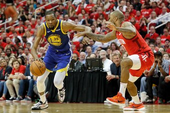 HOUSTON, TX - MAY 04:  Kevin Durant #35 of the Golden State Warriors drives to the basket defended by PJ Tucker #17 of the Houston Rockets in the second half during Game Three of the Second Round of the 2019 NBA Western Conference Playoffs at Toyota Cente