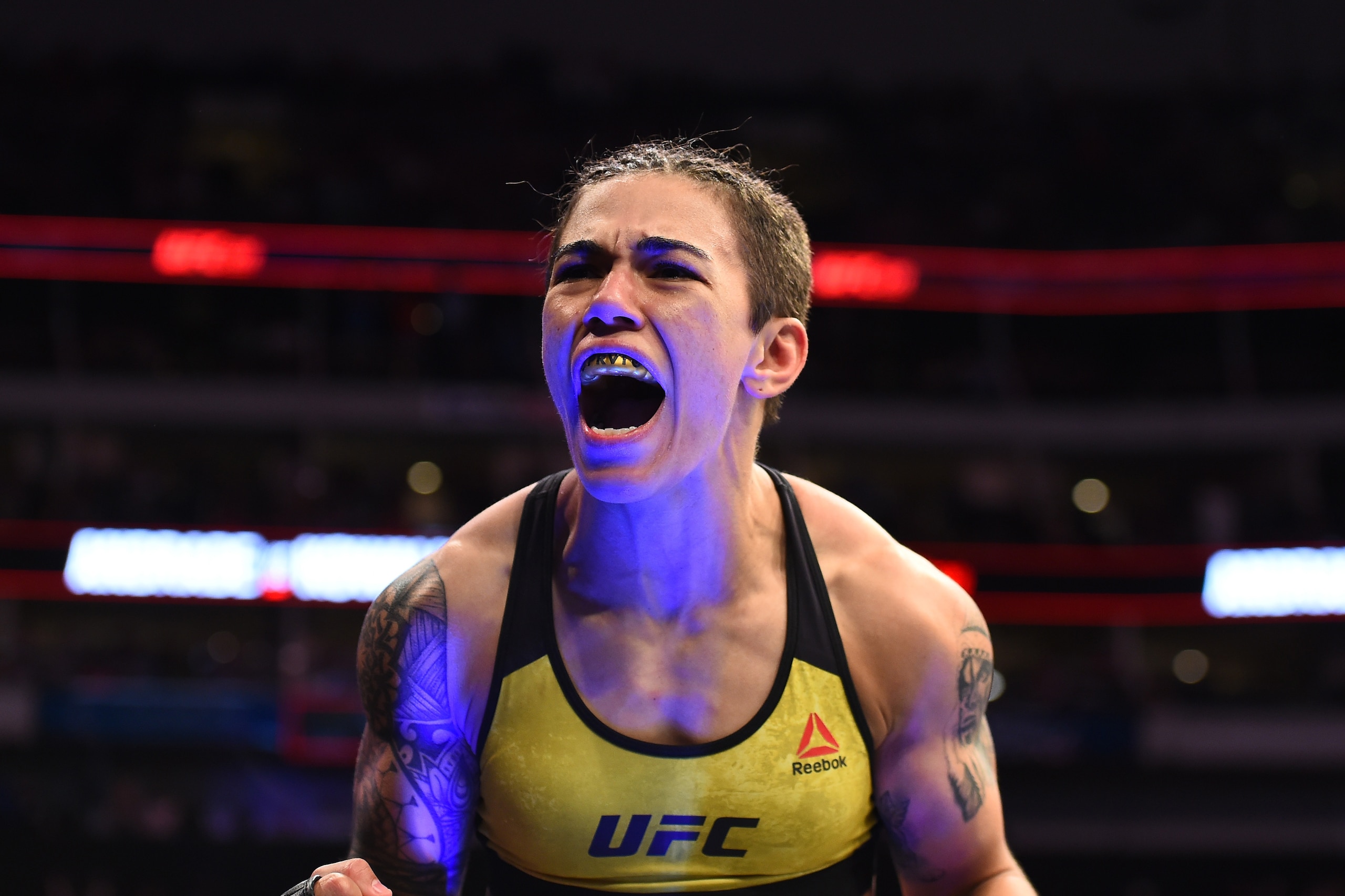 DALLAS, TX - SEPTEMBER 08:  Jessica Andrade of Brazil celebrates after knocking out Karolina Kowalkiewicz of Poland in their women's strawweight fight during the UFC 228 event at American Airlines Center on September 8, 2018 in Dallas, Texas. (Photo by Jo