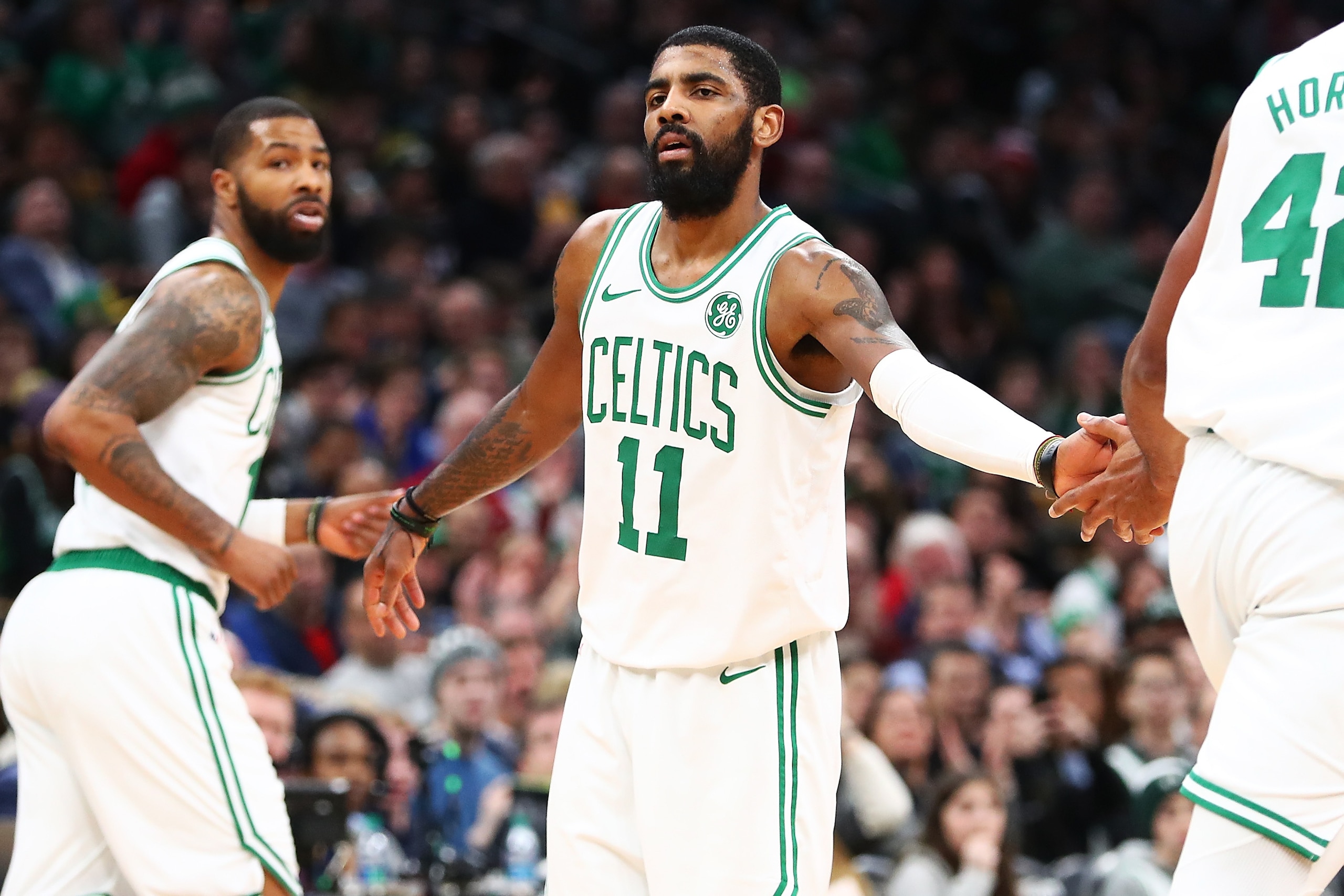 BOSTON, MA - JANUARY 21:  Kyrie Irving #11 high fives Marcus Morris #13 and Al Horford #42 of the Boston Celtics during a game against ethics's Miami Heat at TD Garden on January 21, 2019 in Boston, Massachusetts. NOTE TO USER: User expressly acknowledges