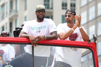 MIAMI, FL - JUNE 24: LeBron James #6 and Juwan Howard of the Miami Heat look on during the NBA championship parade through downtown on June 24, 2013 in Miami, Florida. NOTE TO USER: User expressly acknowledges and agrees that, by downloading and or using 
