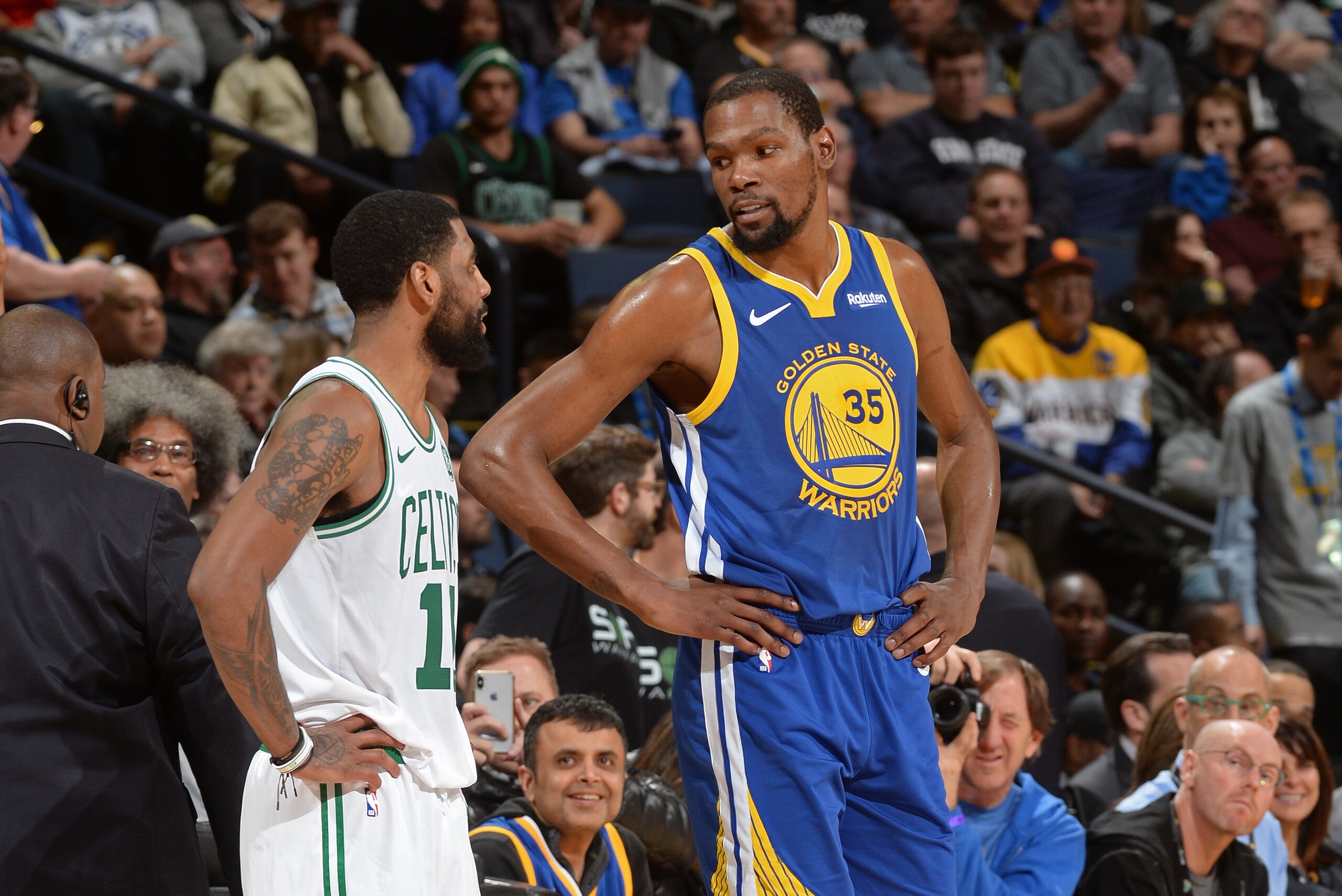 OAKLAND, CA - MARCH 5: Kyrie Irving #11 of the Boston Celtics and Kevin Durant #35 of the Golden State Warriors talk during the game on March 5, 2019 at ORACLE Arena in Oakland, California. NOTE TO USER: User expressly acknowledges and agrees that, by dow