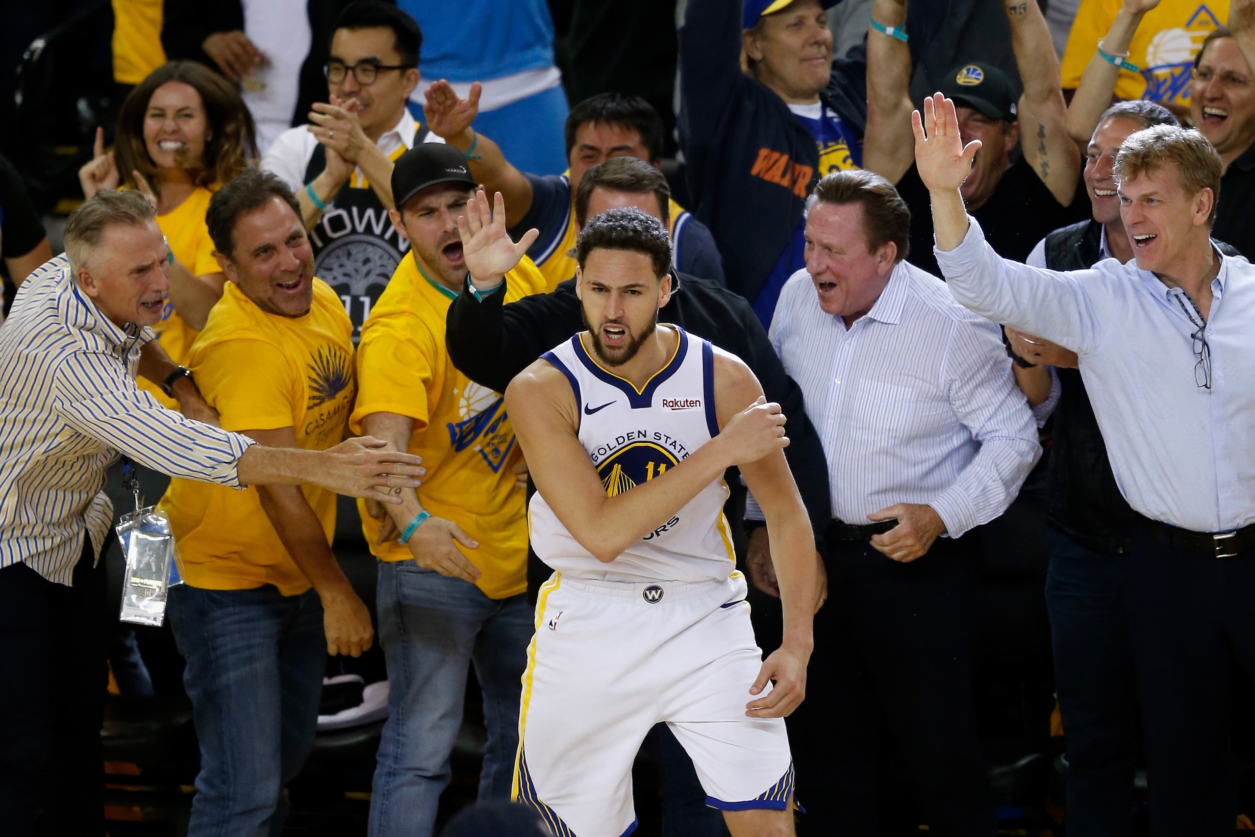 OAKLAND, CALIFORNIA - MAY 08: Klay Thompson #11 of the Golden State Warriors celebrates with fans during Game Five of the Western Conference Semifinals of the 2019 NBA Playoffs against the Houston Rockets at ORACLE Arena on May 08, 2019 in Oakland, Califo