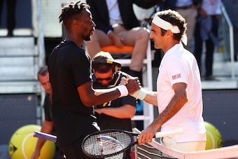 MADRID, SPAIN - MAY 09:  Roger Federer of Switzerland is congratulated by Gael Monfils of France after his three set win during day six of the Mutua Madrid Open at La Caja Magica on May 09, 2019 in Madrid, Spain. (Photo by Julian Finney/Getty Images)