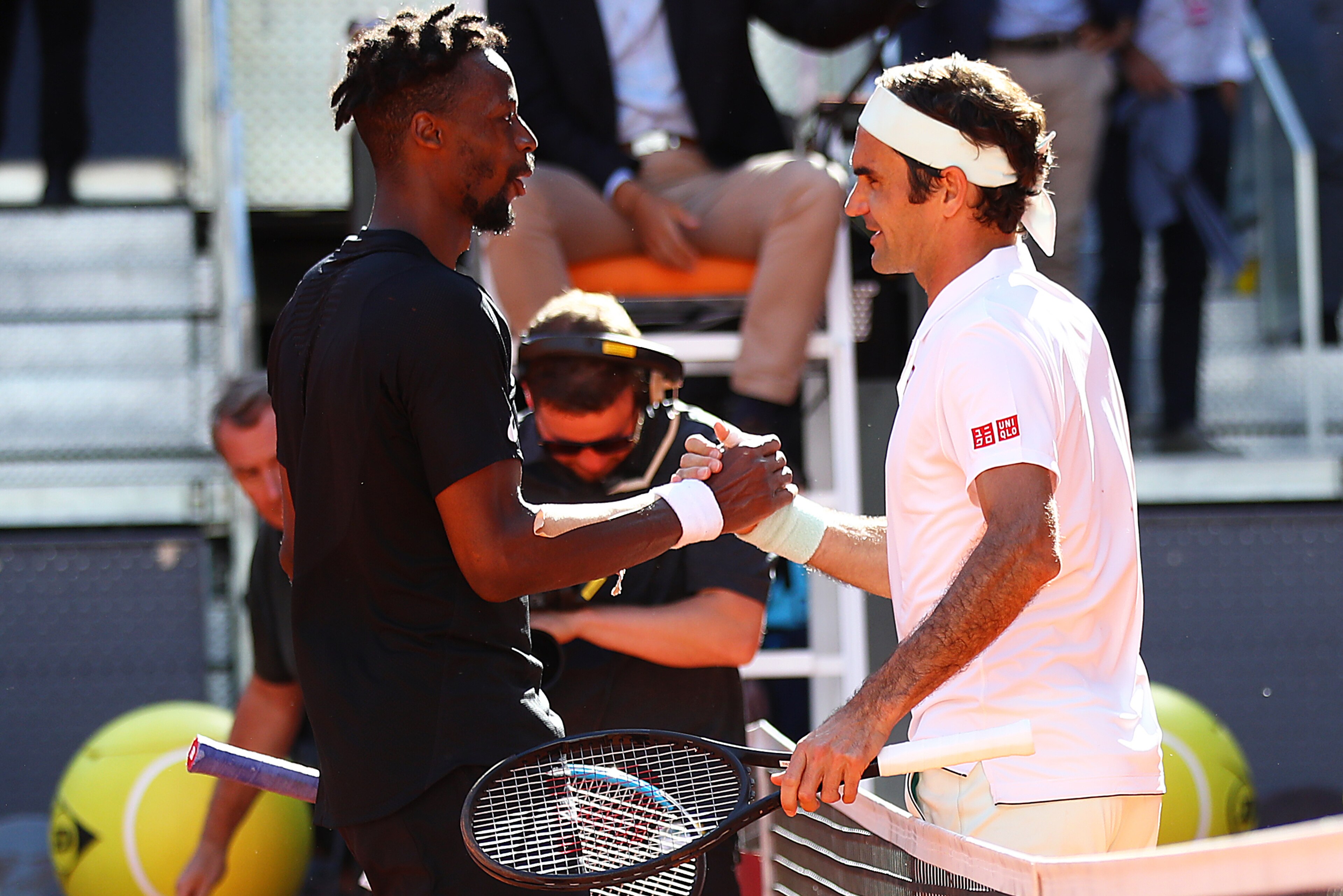 MADRID, SPAIN - MAY 09:  Roger Federer of Switzerland is congratulated by Gael Monfils of France after his three set win during day six of the Mutua Madrid Open at La Caja Magica on May 09, 2019 in Madrid, Spain. (Photo by Julian Finney/Getty Images)
