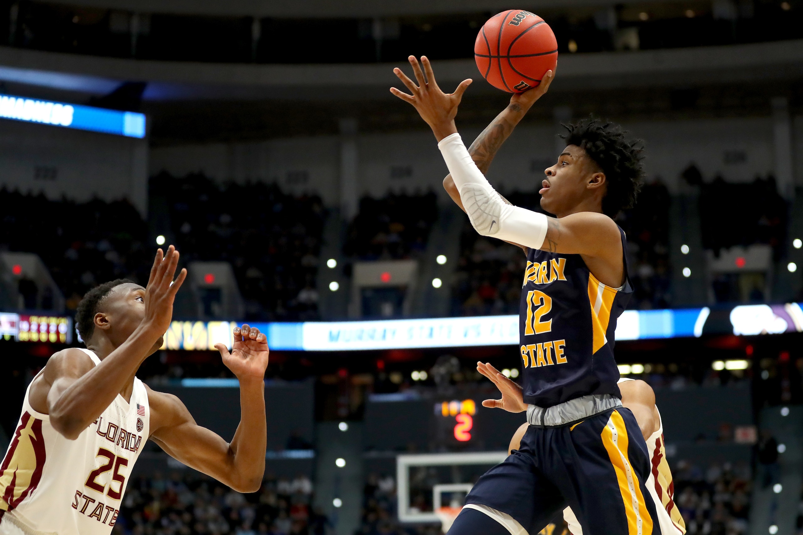 HARTFORD, CONNECTICUT - MARCH 23:  Ja Morant #12 of the Murray State Racers attempts a shot against Mfiondu Kabengele #25 of the Florida State Seminoles in the second half during the second round of the 2019 NCAA Men's Basketball Tournament at XL Center o