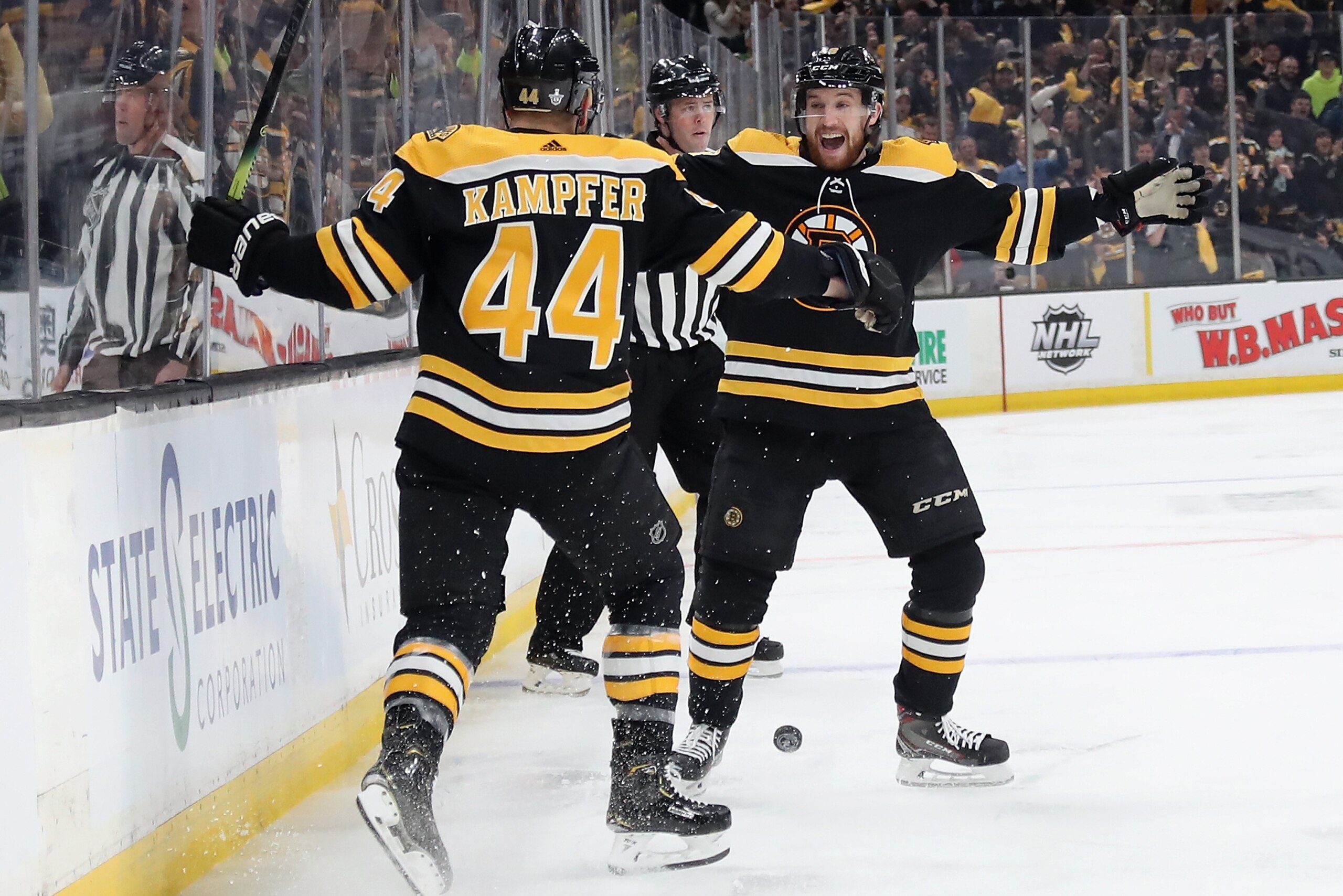BOSTON, MASSACHUSETTS - MAY 09: Steven Kampfer #44 of the Boston Bruins celebrates with Matt Grzelcyk #48 after scoring a goal during the first period in Game One of the Eastern Conference Final against the Carolina Hurricanes during the 2019 NHL Stanley BOSTON, MASSACHUSETTS - MAY 09: Steven Kampfer #44 of the Boston Bruins celebrates with Matt Grzelcyk #48 after scoring a goal during the first period in Game One of the Eastern Conference Final against the Carolina Hurricanes during the 2019 NHL Stanley