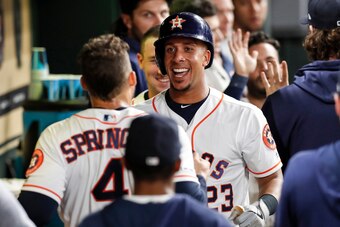 HOUSTON, TX - MAY 08:  Michael Brantley #23 of the Houston Astros celebrates with teammates in the dugout after a two run home run in the third inning against the Kansas City Royals at Minute Maid Park on May 8, 2019 in Houston, Texas.  (Photo by Tim Warn