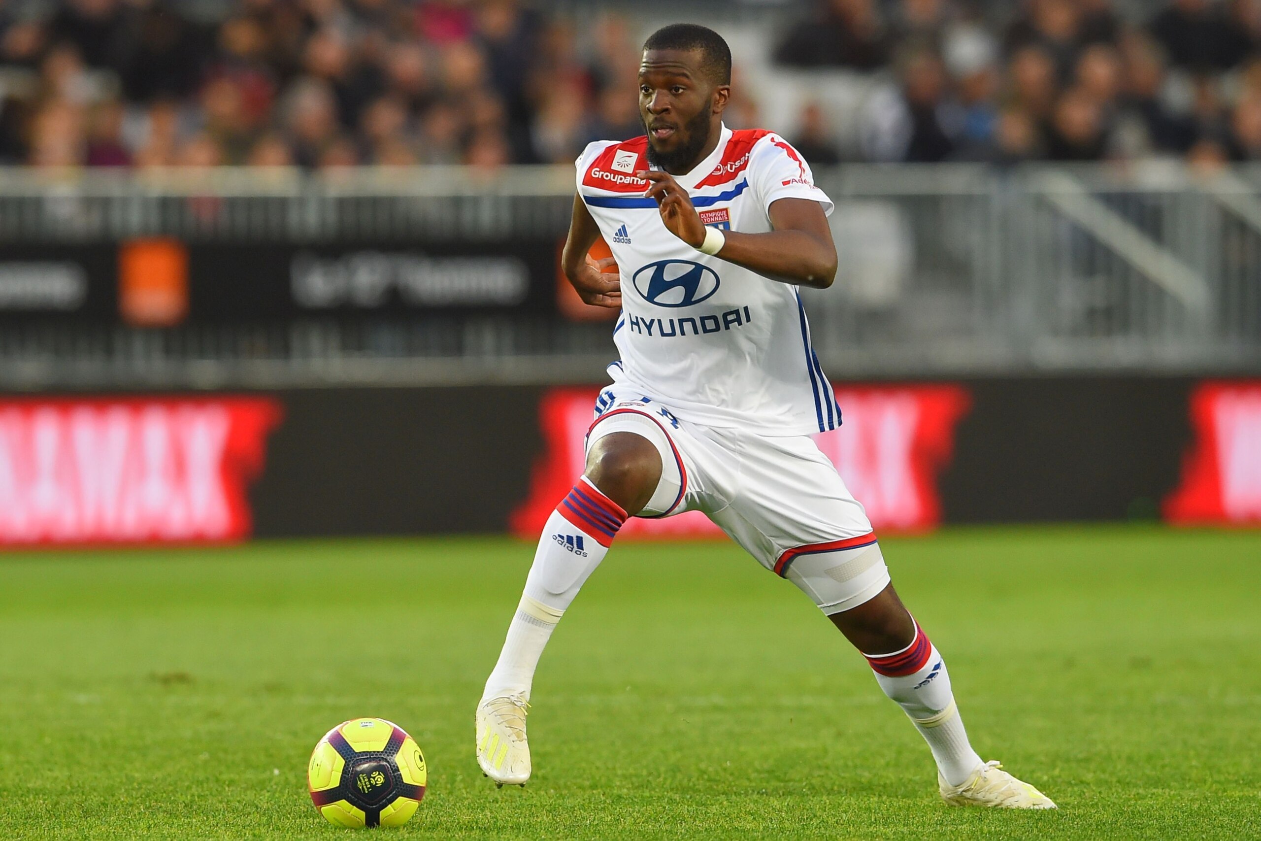 Lyon's French midfielder Tanguy Ndombele runs with the ball during the French L1 football match between Bordeaux (FCGB) and Lyon (OL) on April 26, 2019 at the Matmut Atlantique stadium in Bordeaux, southwestern France. (Photo by NICOLAS TUCAT / AFP)      