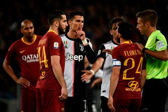 Juventus' Portuguese forward Cristiano Ronaldo (C) gestures next to AS Roma Greek defender Konstantinos Manolas (L) and AS Roma Italian midfielder Alessandro Florenzi (2R) during the Italian Serie A football match between AS Roma and Juventus Turin at the