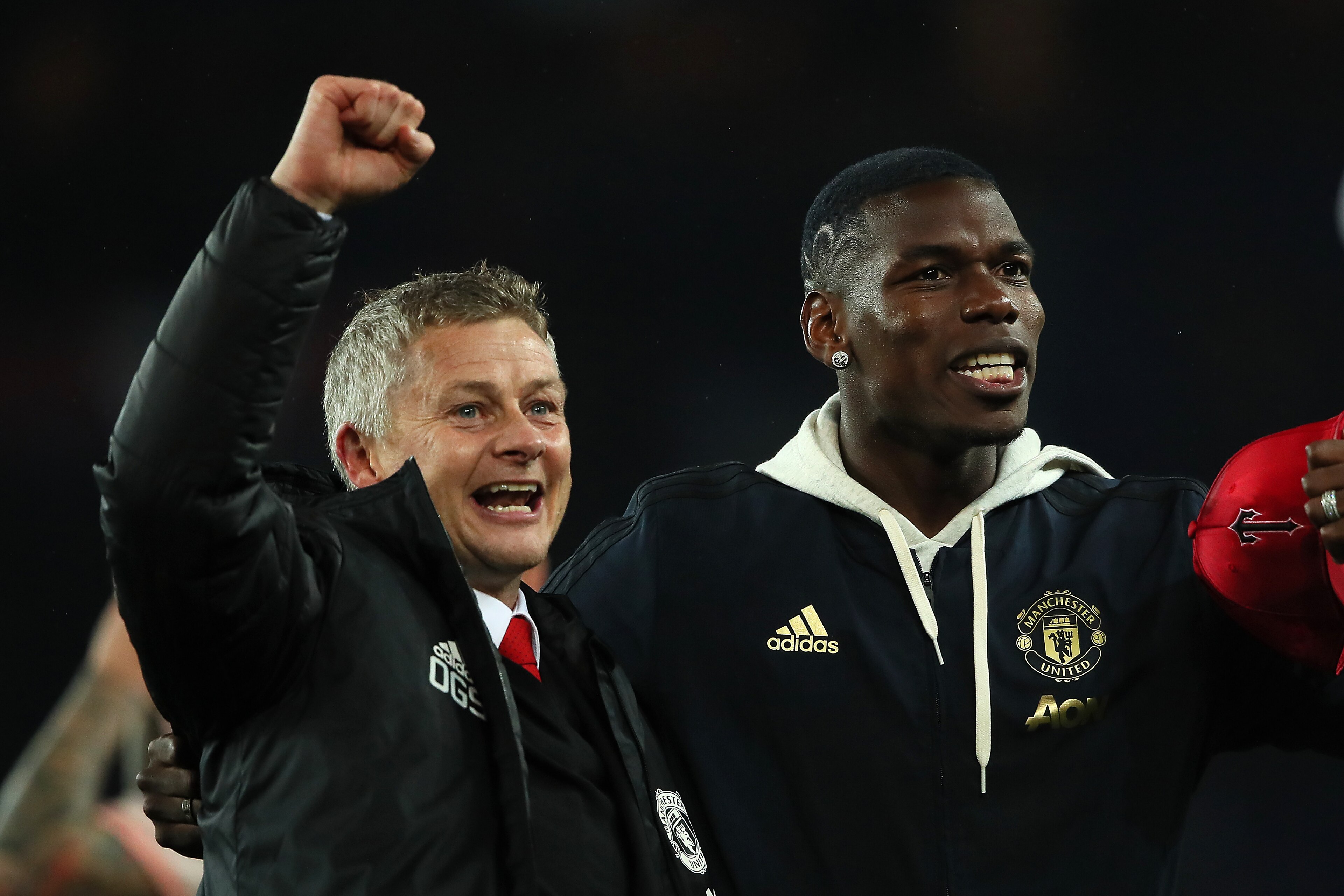 PARIS, FRANCE - MARCH 06:  Manchester United Head Coach / Manager Ole Gunnar Solskjaer and Paul Pogba of Manchester United celebrate at the end of the UEFA Champions League Round of 16 Second Leg match between Paris Saint-Germain and Manchester United at 