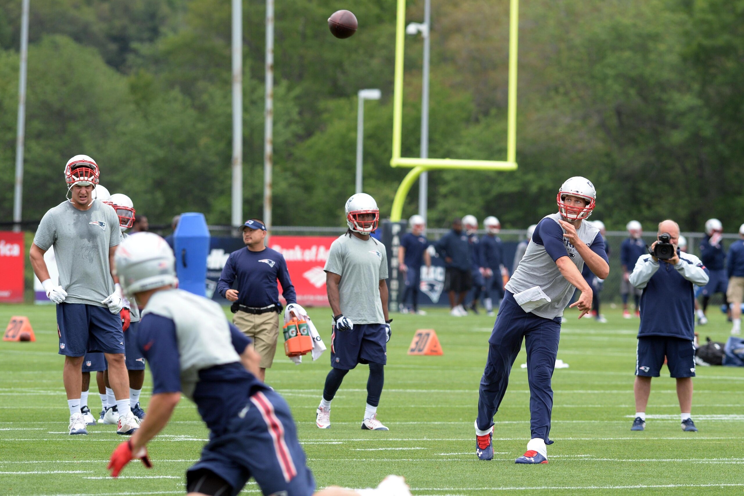 FOXBOROUGH, MA - JUNE 4: Tom Brady #12 of the New England Patriots, throws the ball during organized team activities at Gillette Stadium on June 4, 2015 in Foxborough, Massachusetts. (Photo by Darren McCollester/Getty Images)