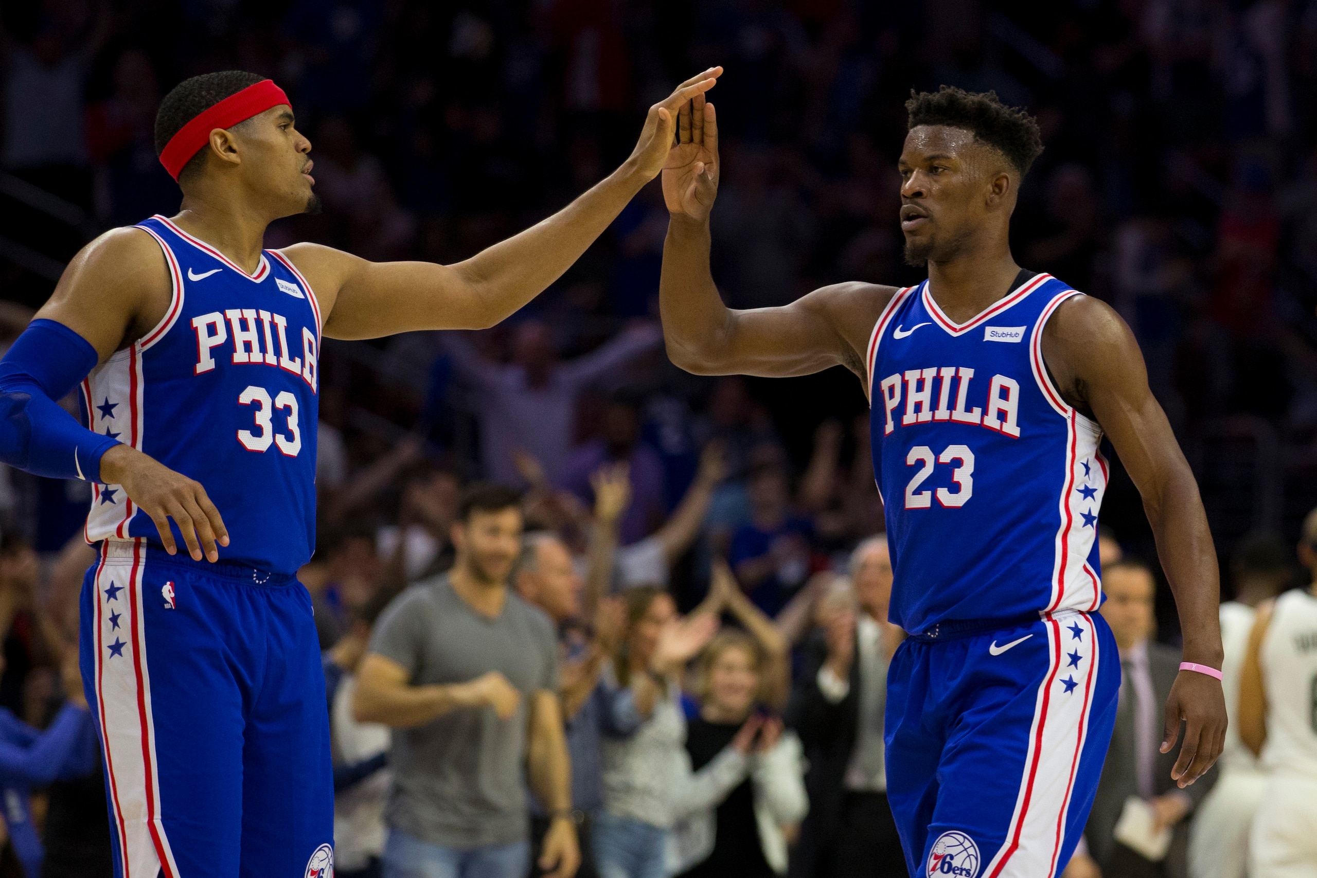 PHILADELPHIA, PA - APRIL 23: Tobias Harris #33 of the Philadelphia 76ers high fives Jimmy Butler #23 against the Brooklyn Nets in Game Five of Round One of the 2019 NBA Playoffs at the Wells Fargo Center on April 23, 2019 in Philadelphia, Pennsylvania. NO