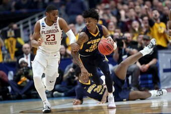 HARTFORD, CONNECTICUT - MARCH 23:  Ja Morant #12 of the Murray State Racers is defended by M.J. Walker #23 of the Florida State Seminoles in the first half during the second round of the 2019 NCAA Men's Basketball Tournament at XL Center on March 23, 2019