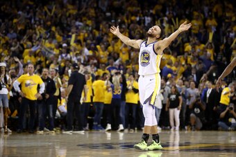 OAKLAND, CALIFORNIA - MAY 08:   Stephen Curry #30 of the Golden State Warriors reacts after Klay Thompson #11 made the clinching basket with four seconds left of their game against the Houston Rockets during Game Five of the Western Conference Semifinals 