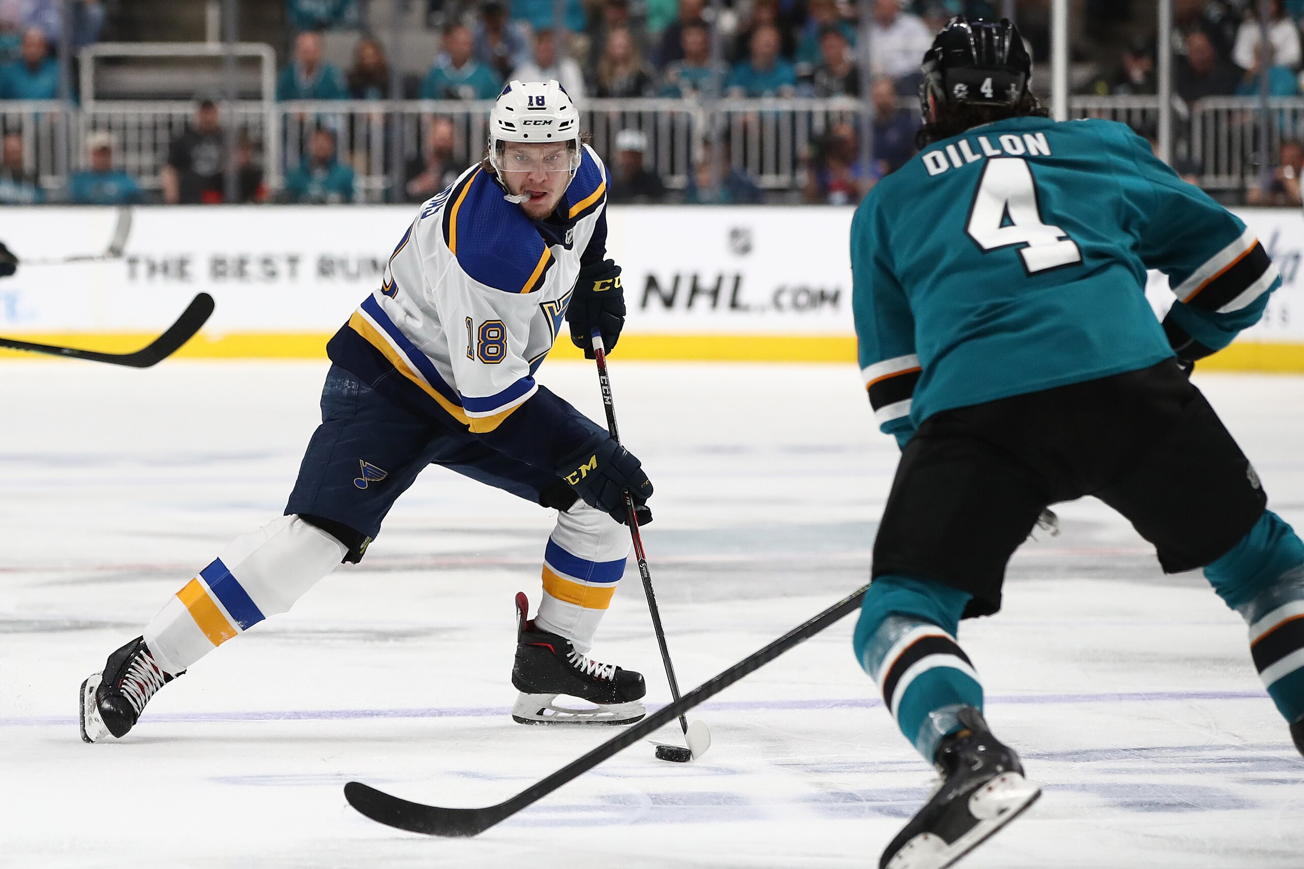 SAN JOSE, CALIFORNIA - MAY 13: Robert Thomas #18 of the St. Louis Blues controls the ball against Brenden Dillon #4 of the San Jose Sharks in Game Two of the Western Conference Final during the 2019 NHL Stanley Cup Playoffs at SAP Center on May 13, 2019 i
