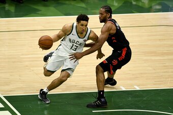 MILWAUKEE, WISCONSIN - MAY 15:  Malcolm Brogdon #13 of the Milwaukee Bucks dribbles the ball while being guarded by Kawhi Leonard #2 of the Toronto Raptors in the second quarter in Game One of the Eastern Conference Finals of the 2019 NBA Playoffs at the 