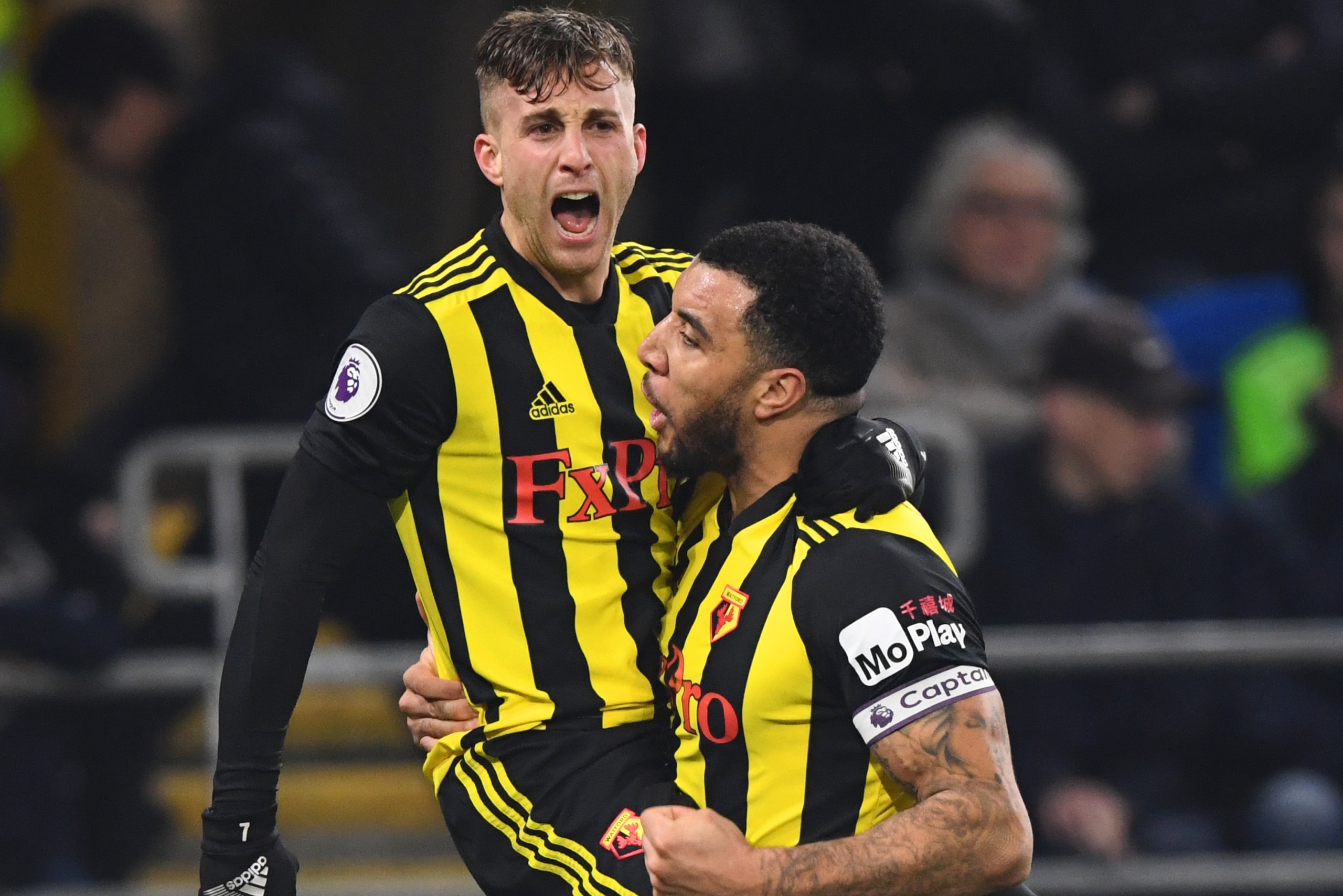 CARDIFF, WALES - FEBRUARY 22:  Gerard Deulofeu of Watford celebrates with Troy Deeney as he scores his team's second goal during the Premier League match between Cardiff City and Watford FC at Cardiff City Stadium on February 22, 2019 in Cardiff, United K