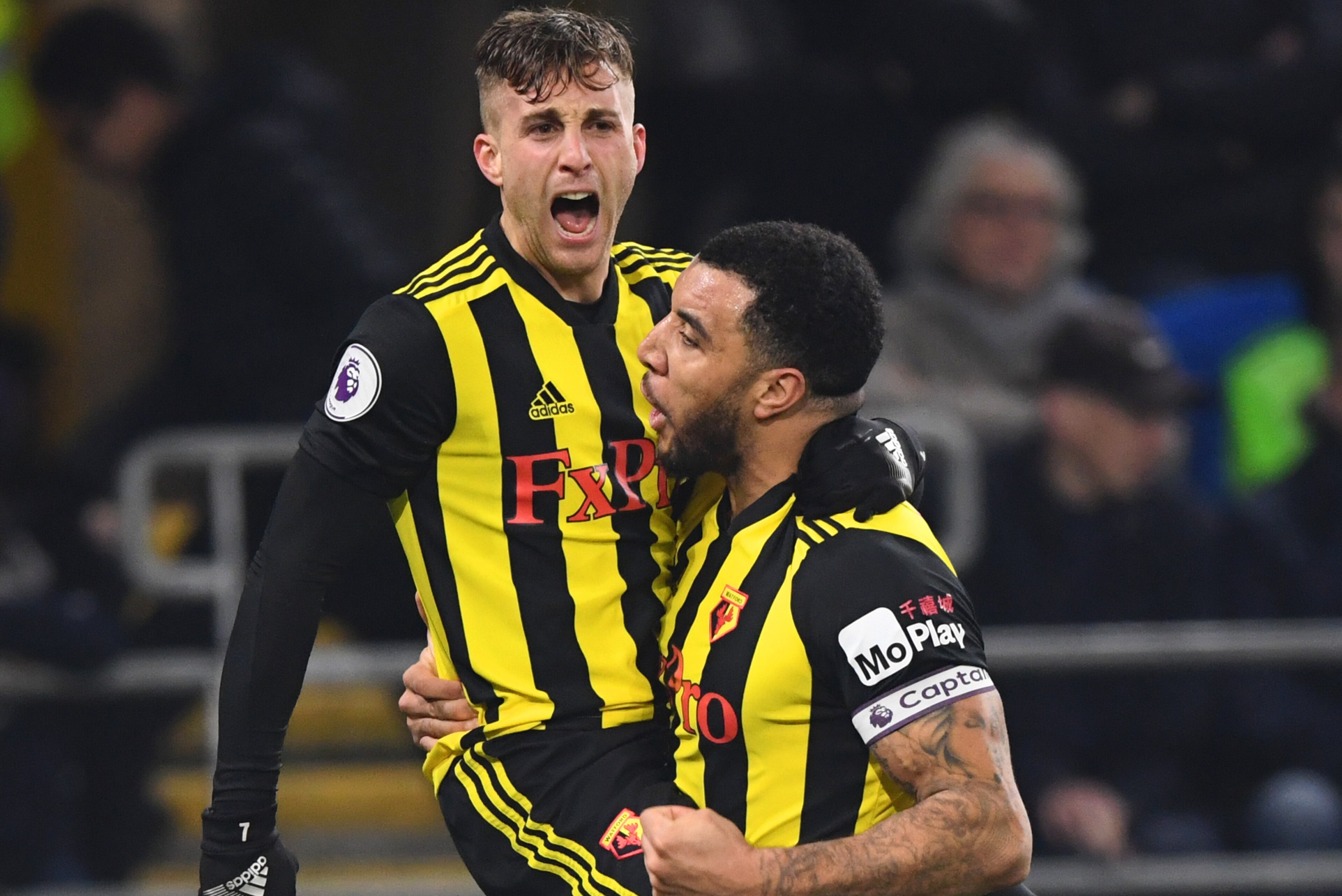 CARDIFF, WALES - FEBRUARY 22:  Gerard Deulofeu of Watford celebrates with Troy Deeney as he scores his team's second goal during the Premier League match between Cardiff City and Watford FC at Cardiff City Stadium on February 22, 2019 in Cardiff, United K